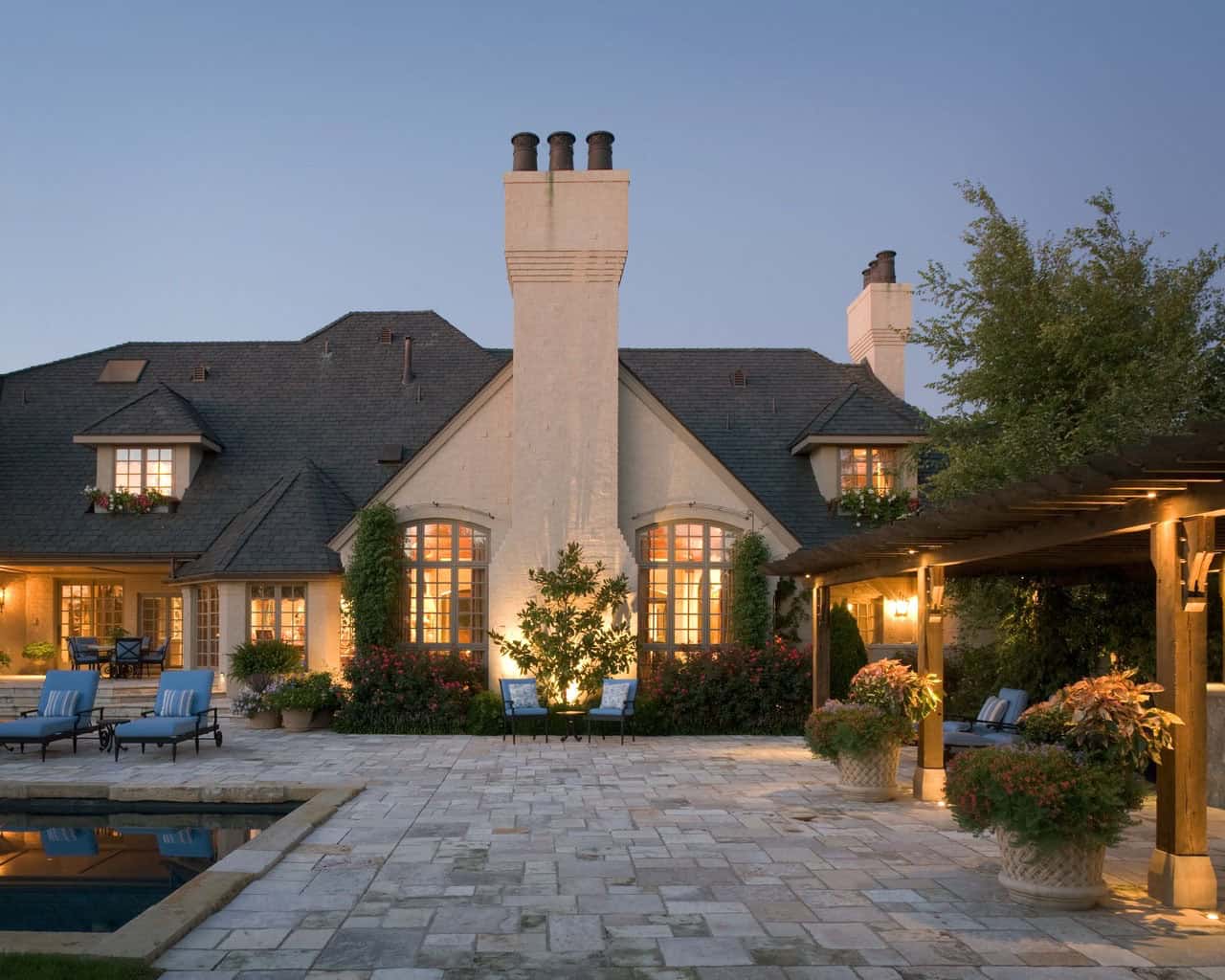 mediterranean style house exterior at dusk