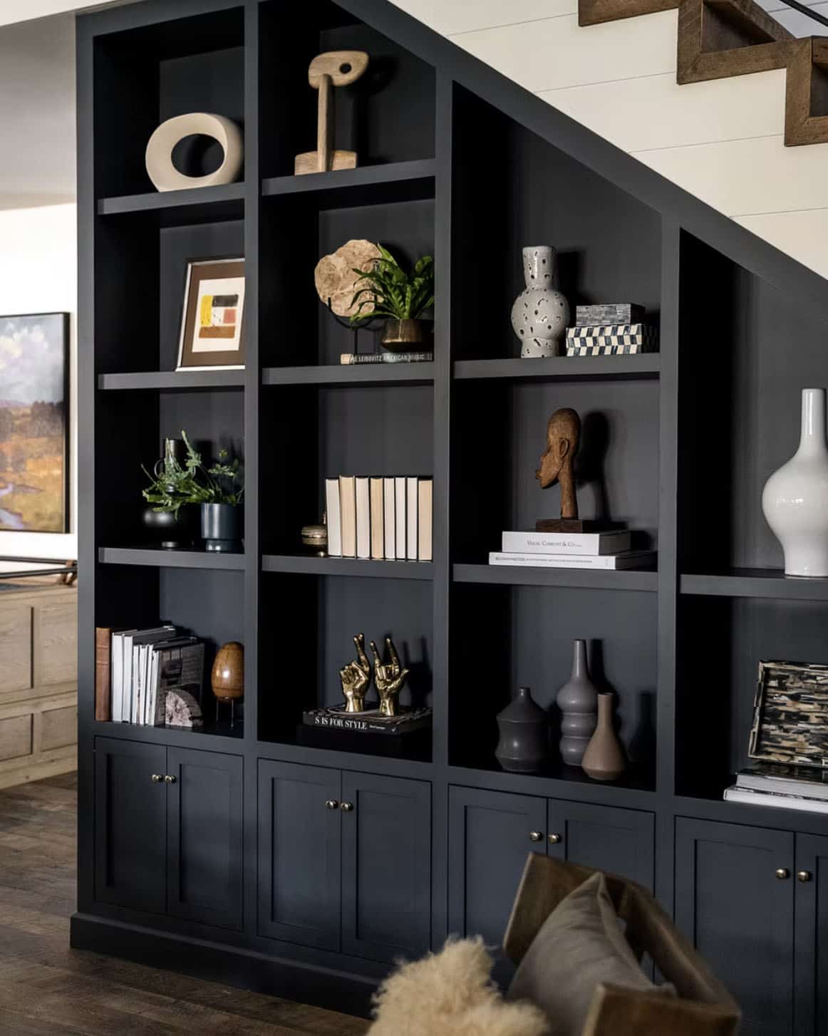 farmhouse style staircase with a built-in bookcase