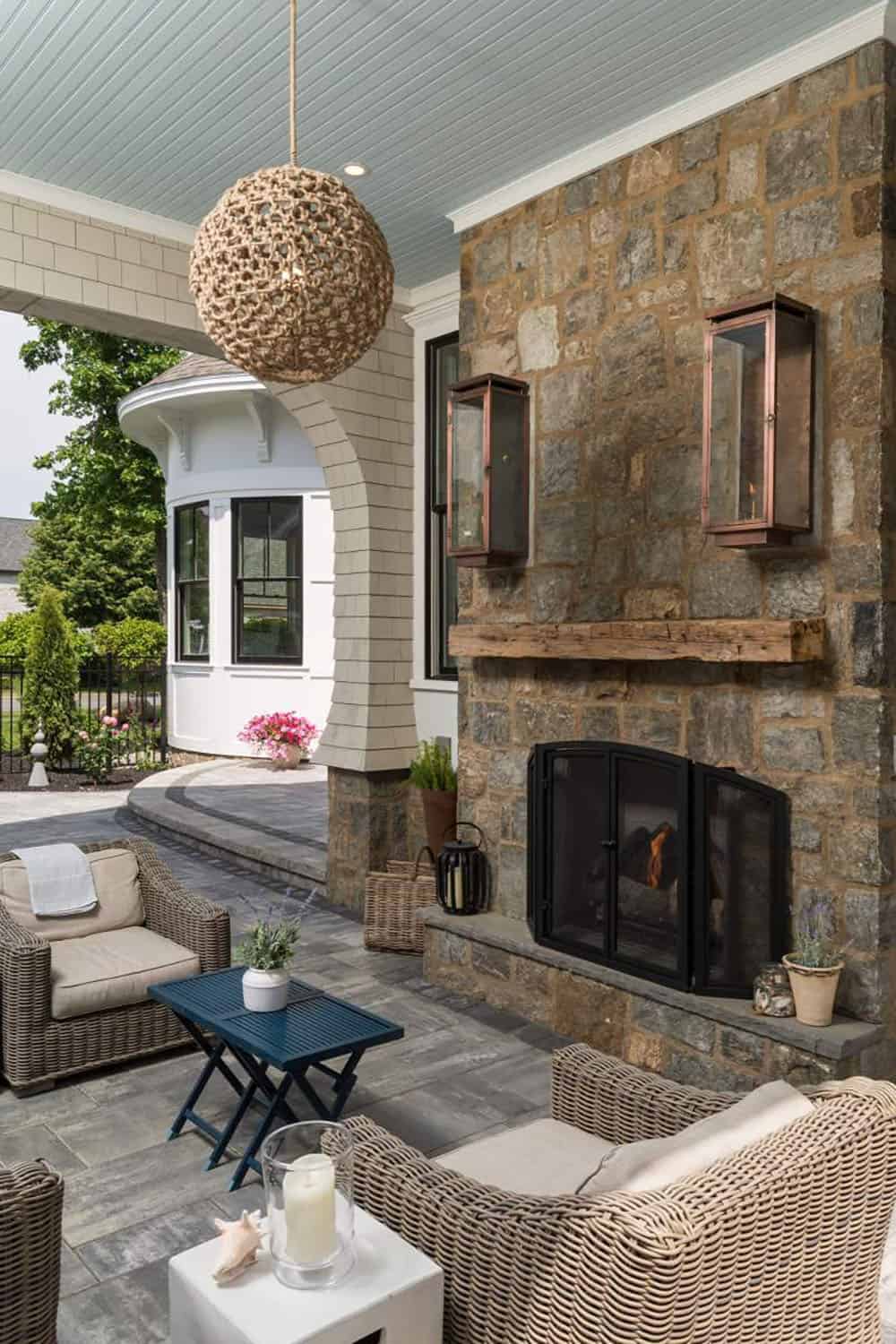 contemporary covered patio with a fireplace