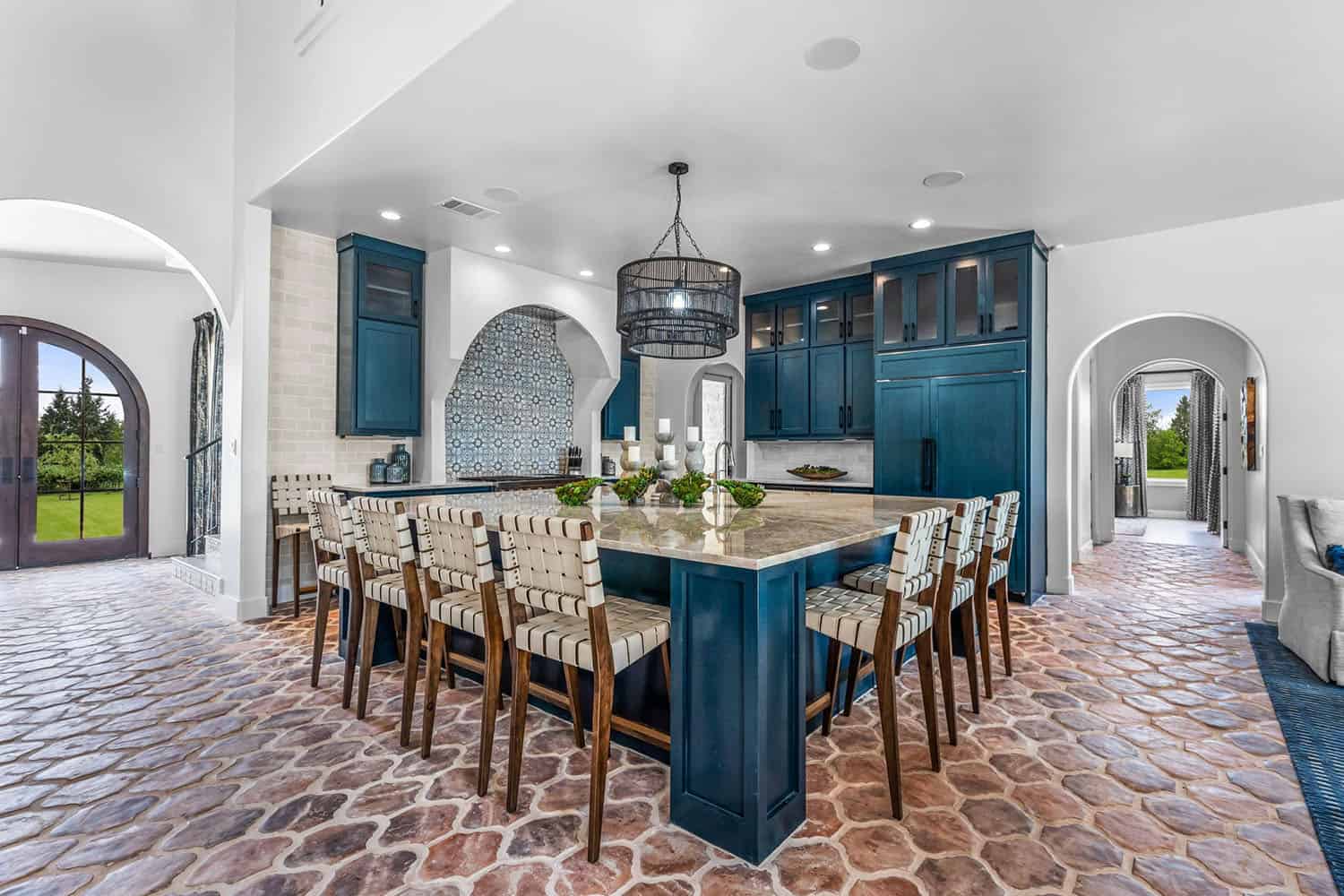 spanish-inspired kitchen with blue cabinets