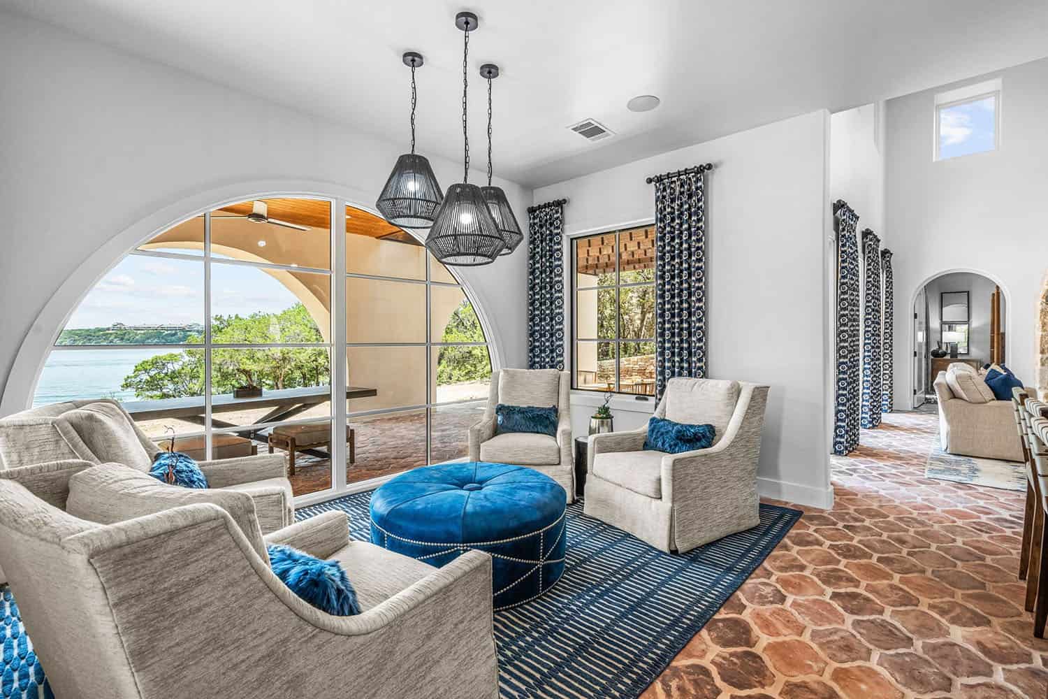 spanish-inspired living room with an arched window