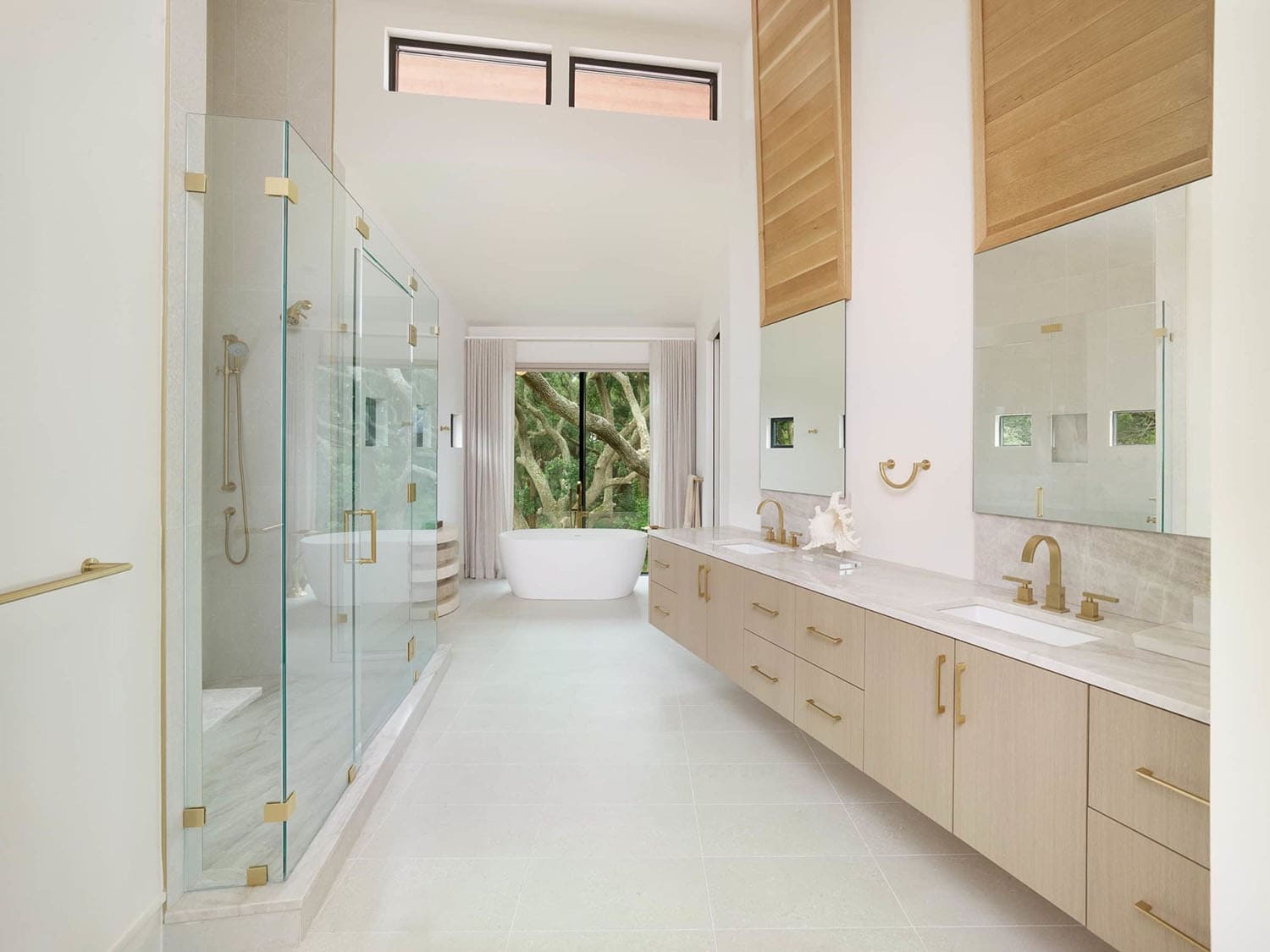 modern bathroom with a dual vanity and freestanding tub