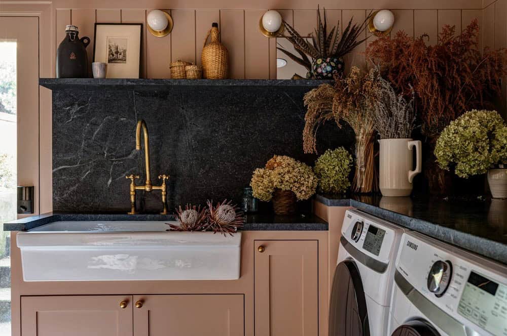 contemporary laundry room with a sink