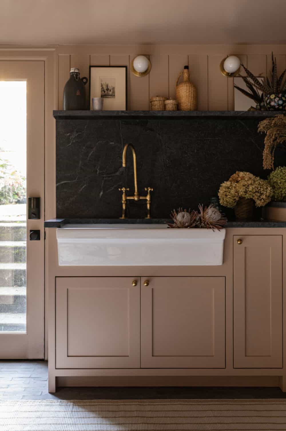 contemporary laundry room with a sink