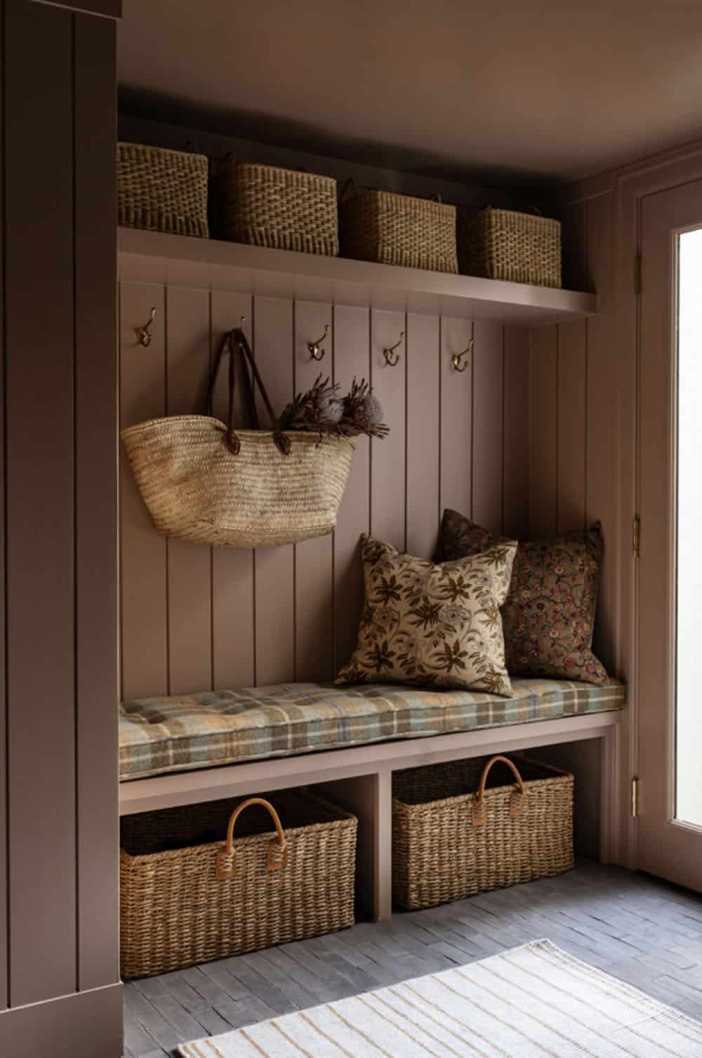 contemporary mudroom with a built-in bench