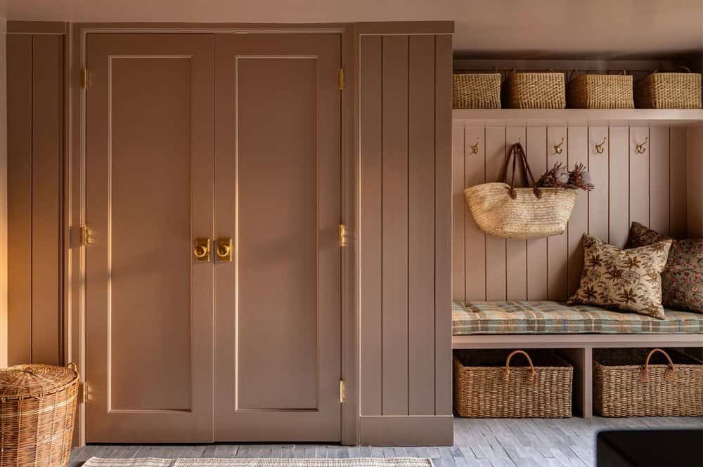 contemporary mudroom with a built-in storage cabinets