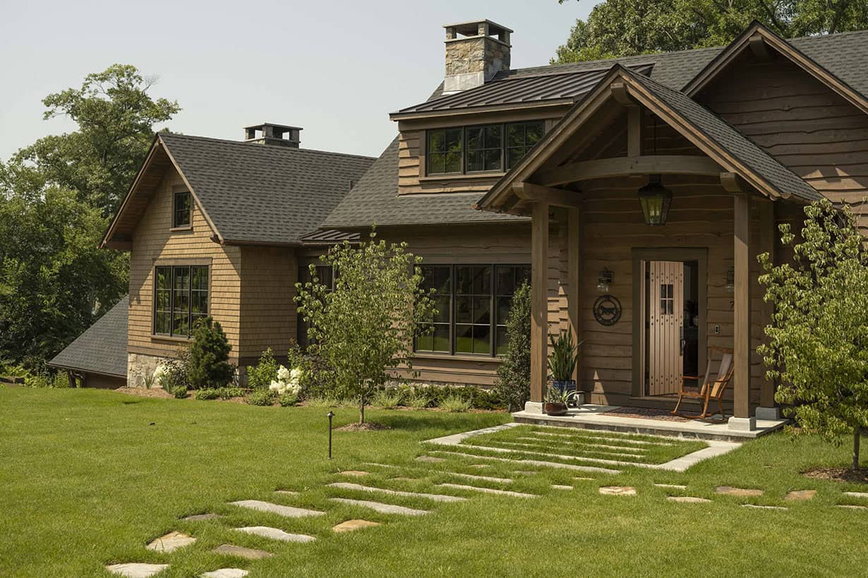 rustic house exterior with grass landscape