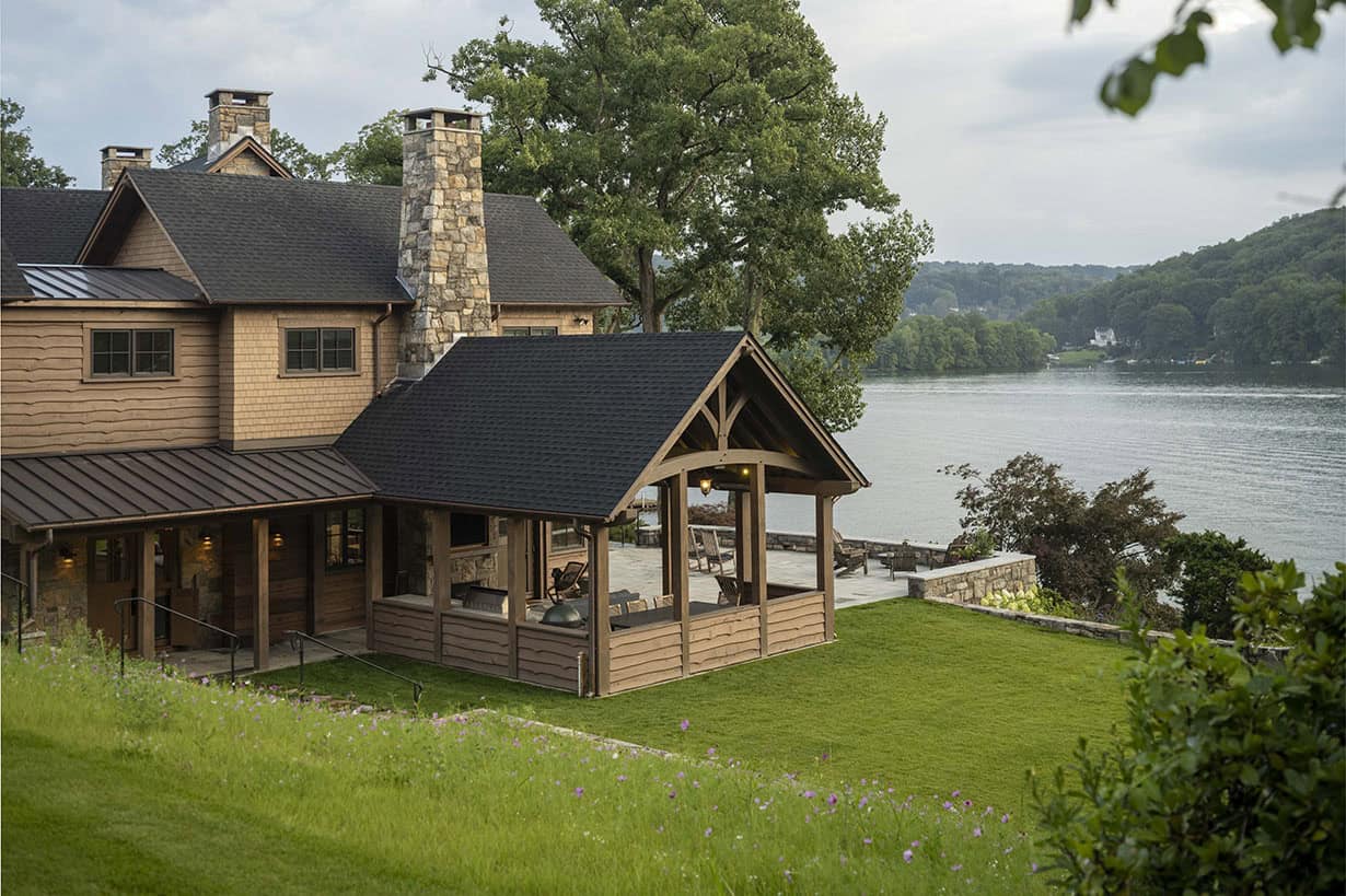 rustic house exterior with a lake view