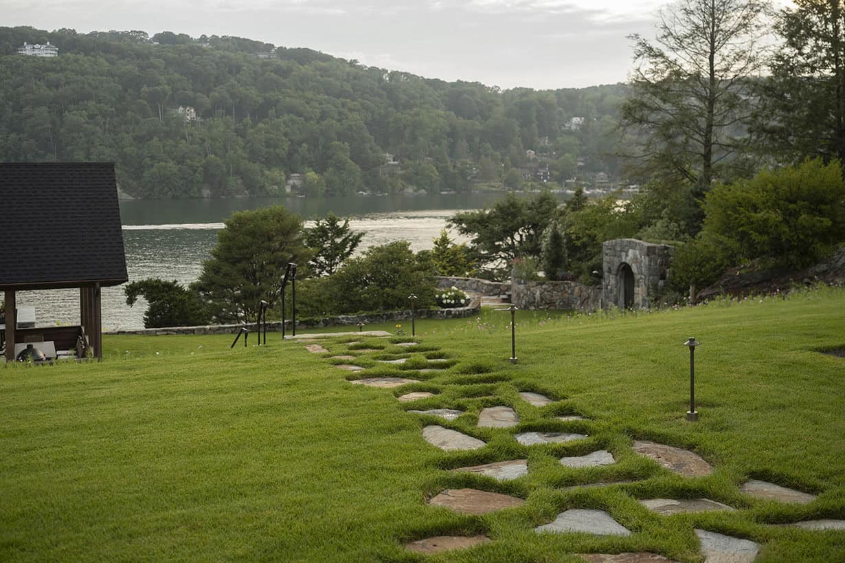 rustic house exterior landscape view with pathway stones