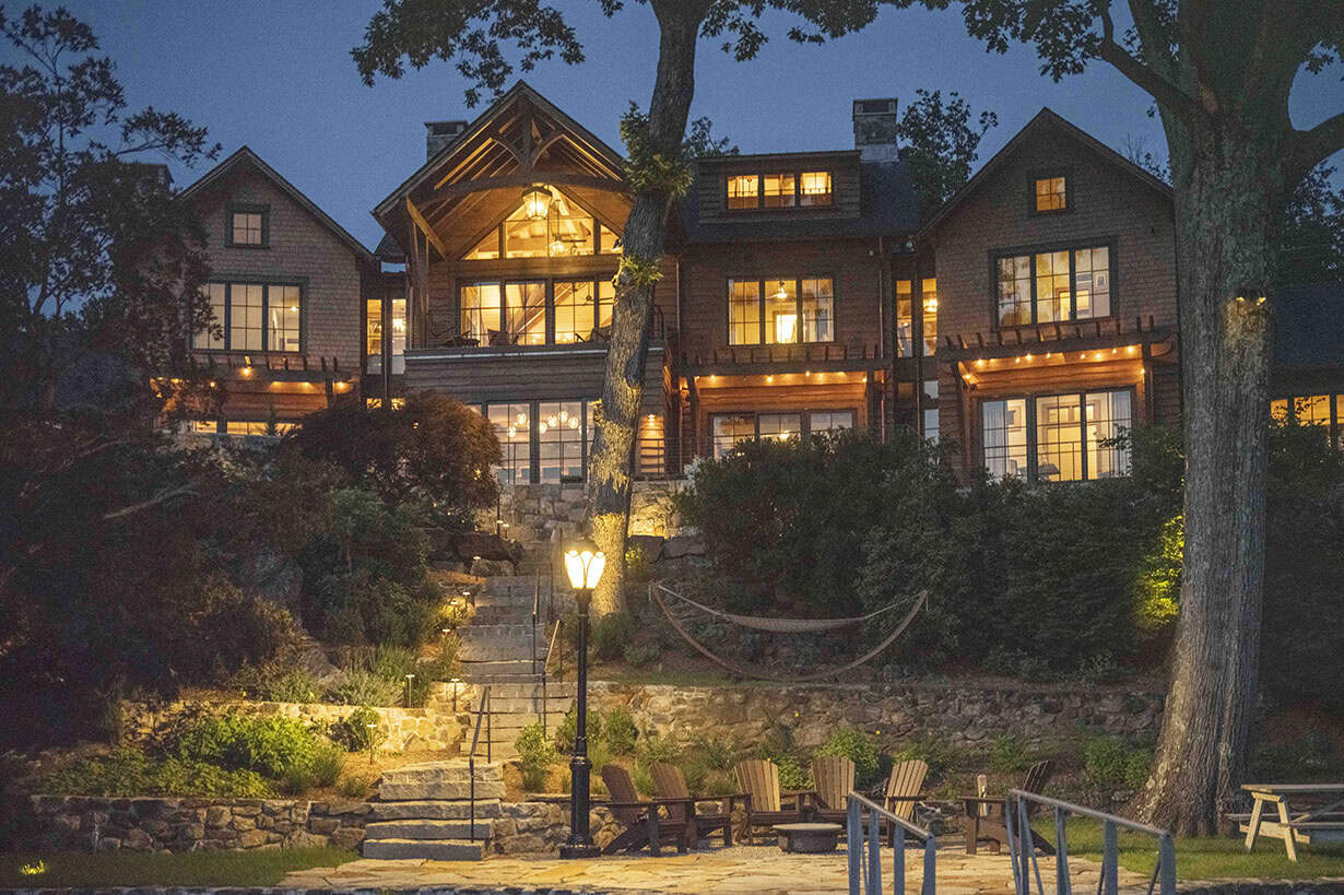 rustic house exterior backyard view at dusk