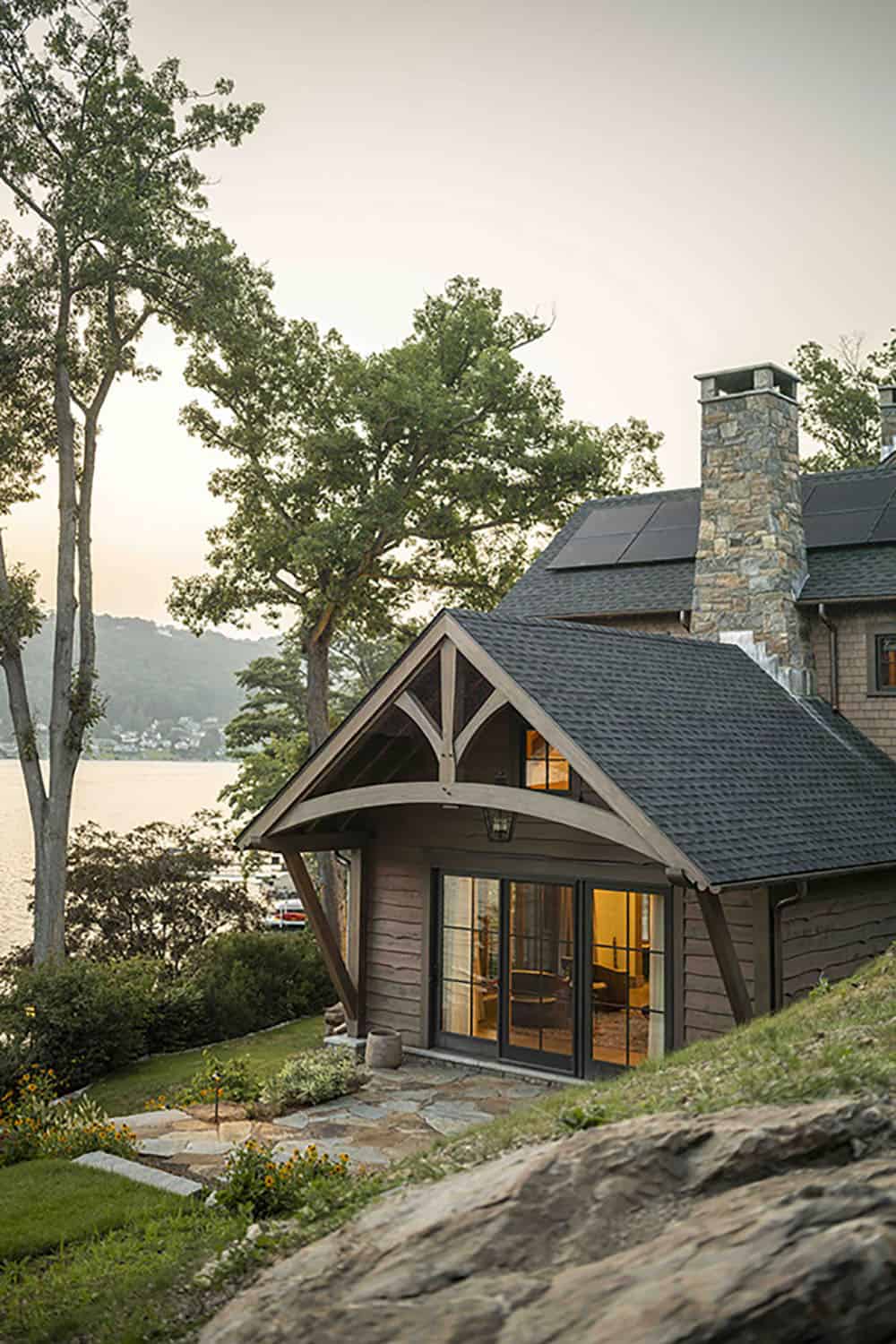 rustic house exterior with a view of the lake