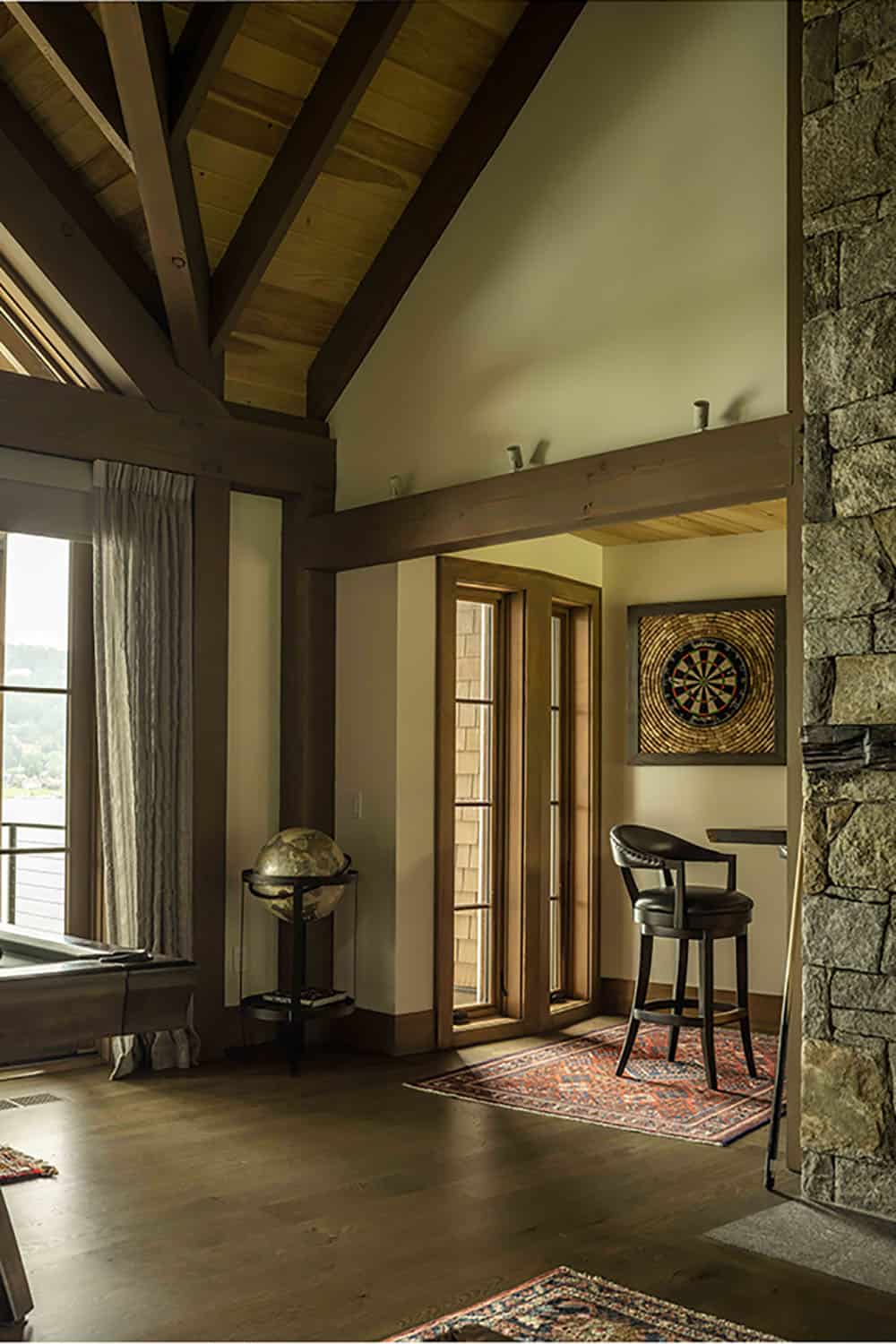 rustic family room with a dart board