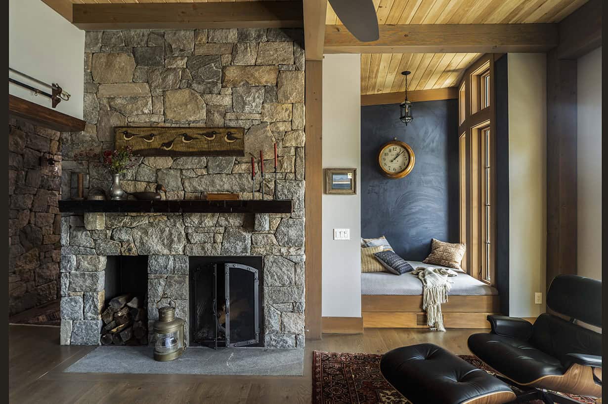 rustic home office with a fireplace and built-in window seat