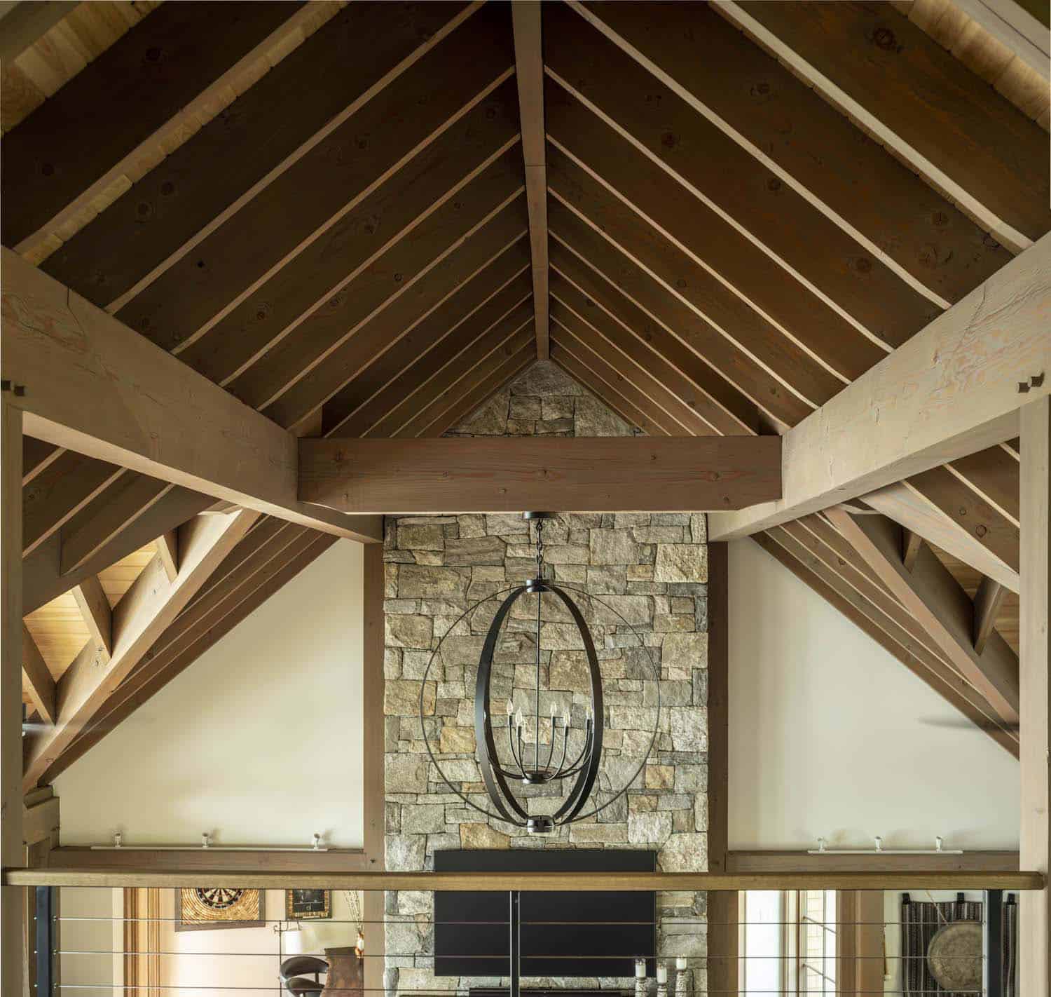 rustic family room ceiling detail with a hanging pendant light