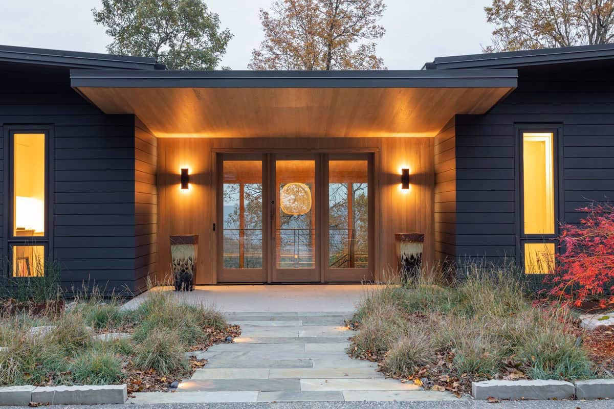 contemporary mountain home exterior at dusk