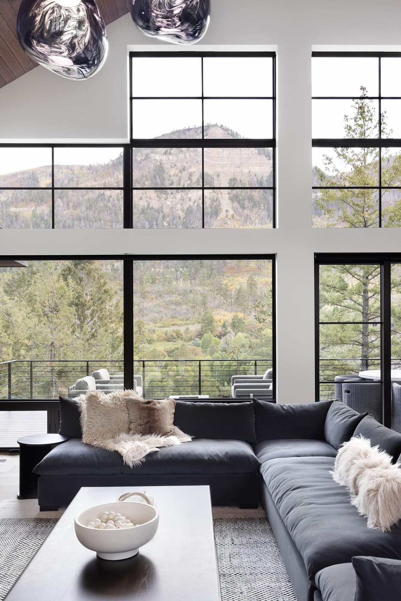 modern rustic living room with large windows
