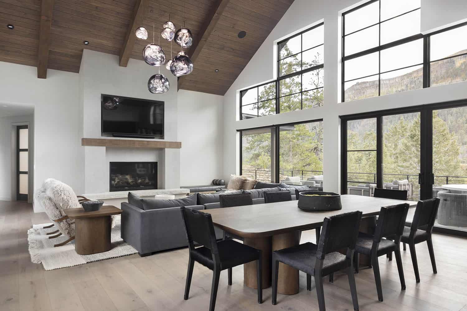 modern rustic dining room with a fireplace
