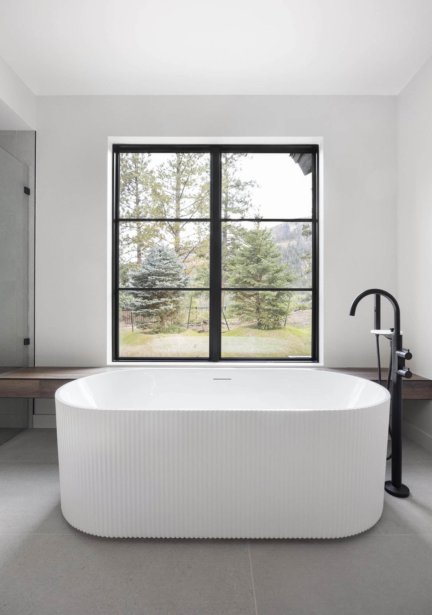 modern rustic bathroom with a soaking tub
