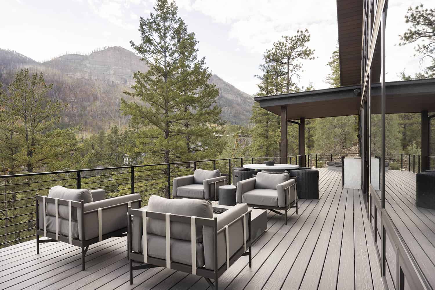modern rustic mountain home patio with outdoor furniture 