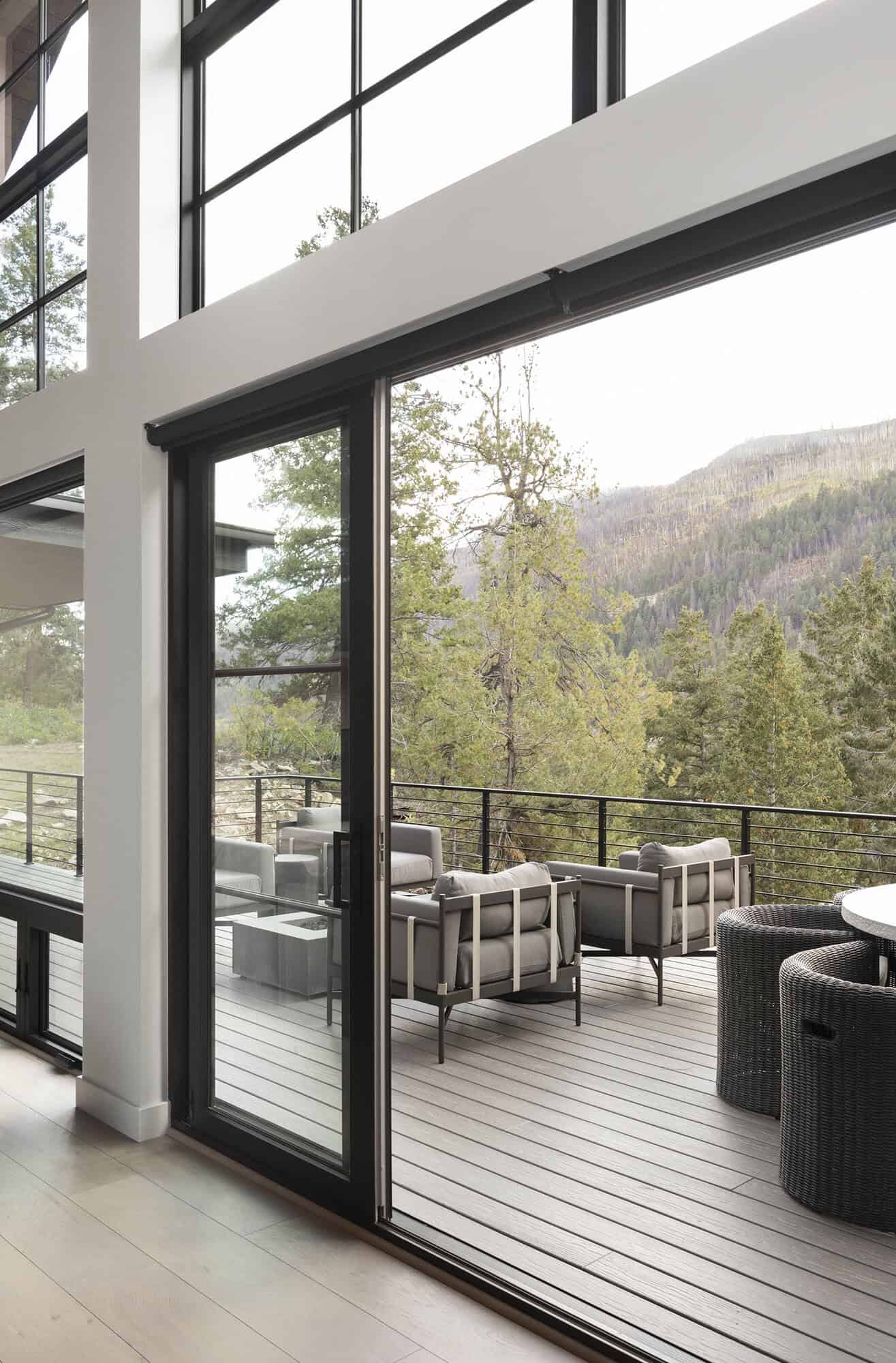modern rustic mountain home patio with outdoor furniture 