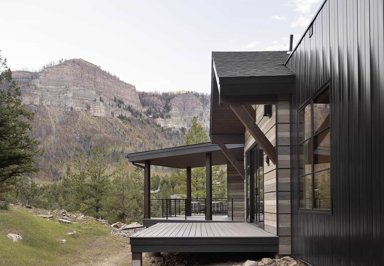 modern rustic mountain home exterior backyard view