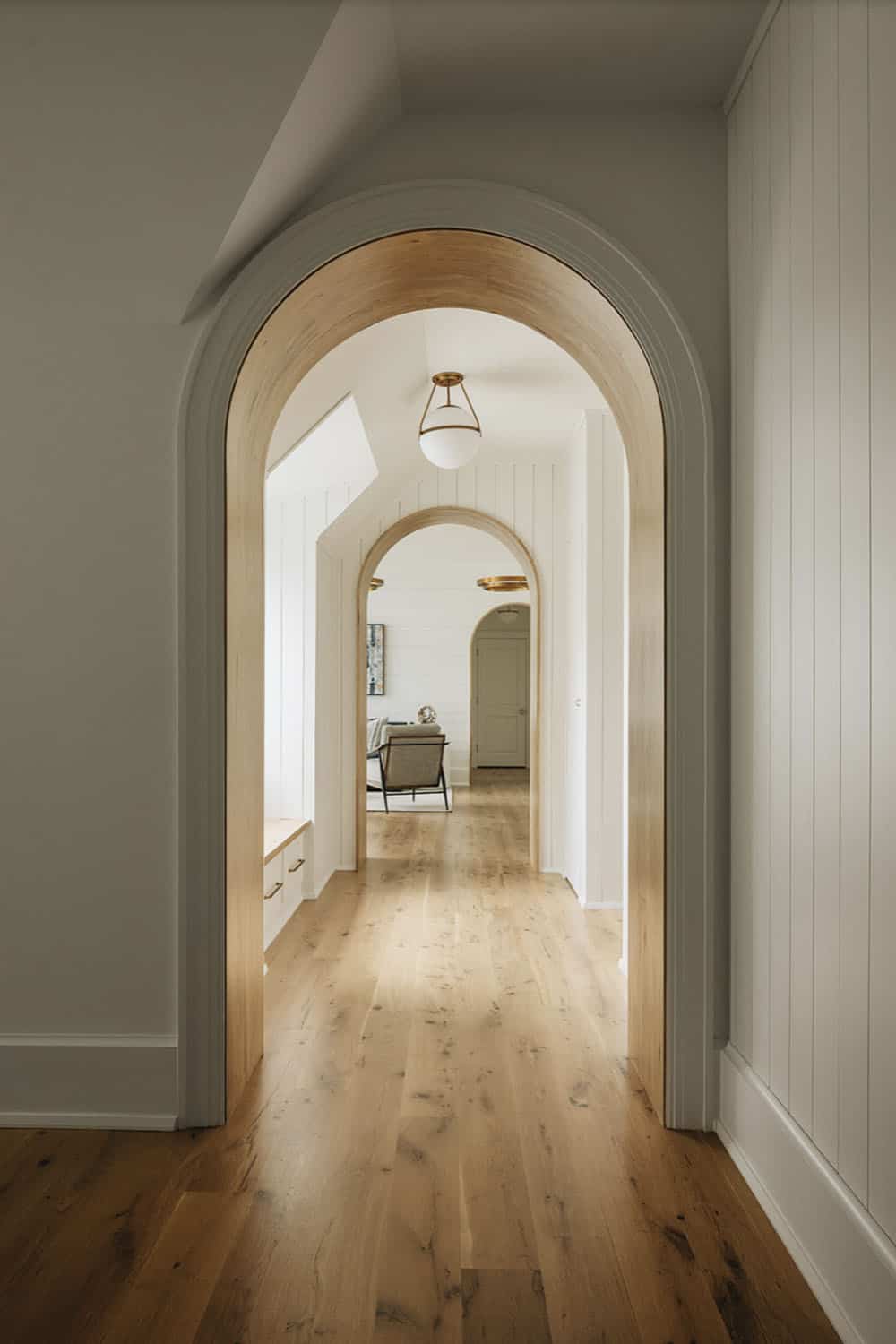 transitional hallway with an archway