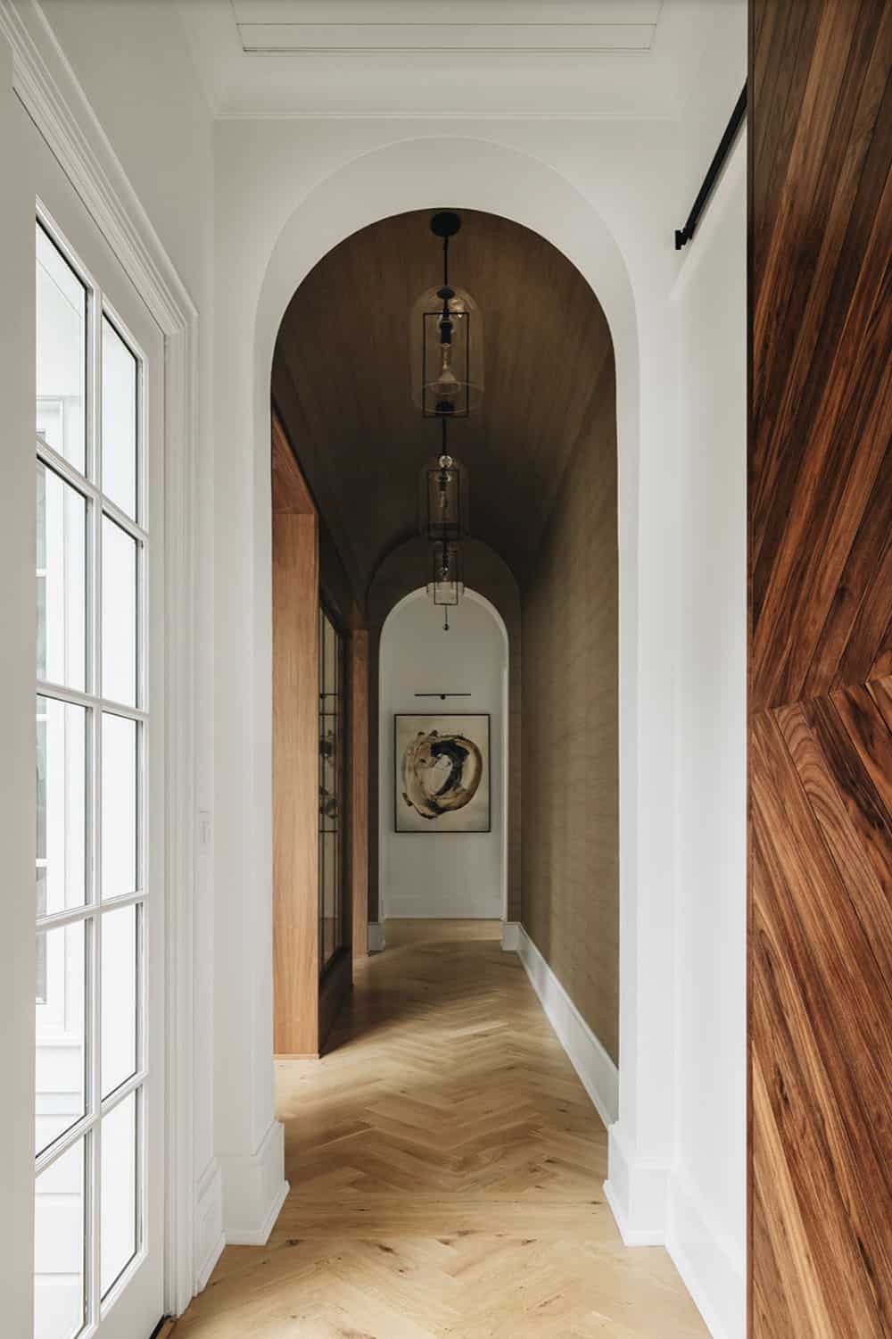 transitional hallway with an archway