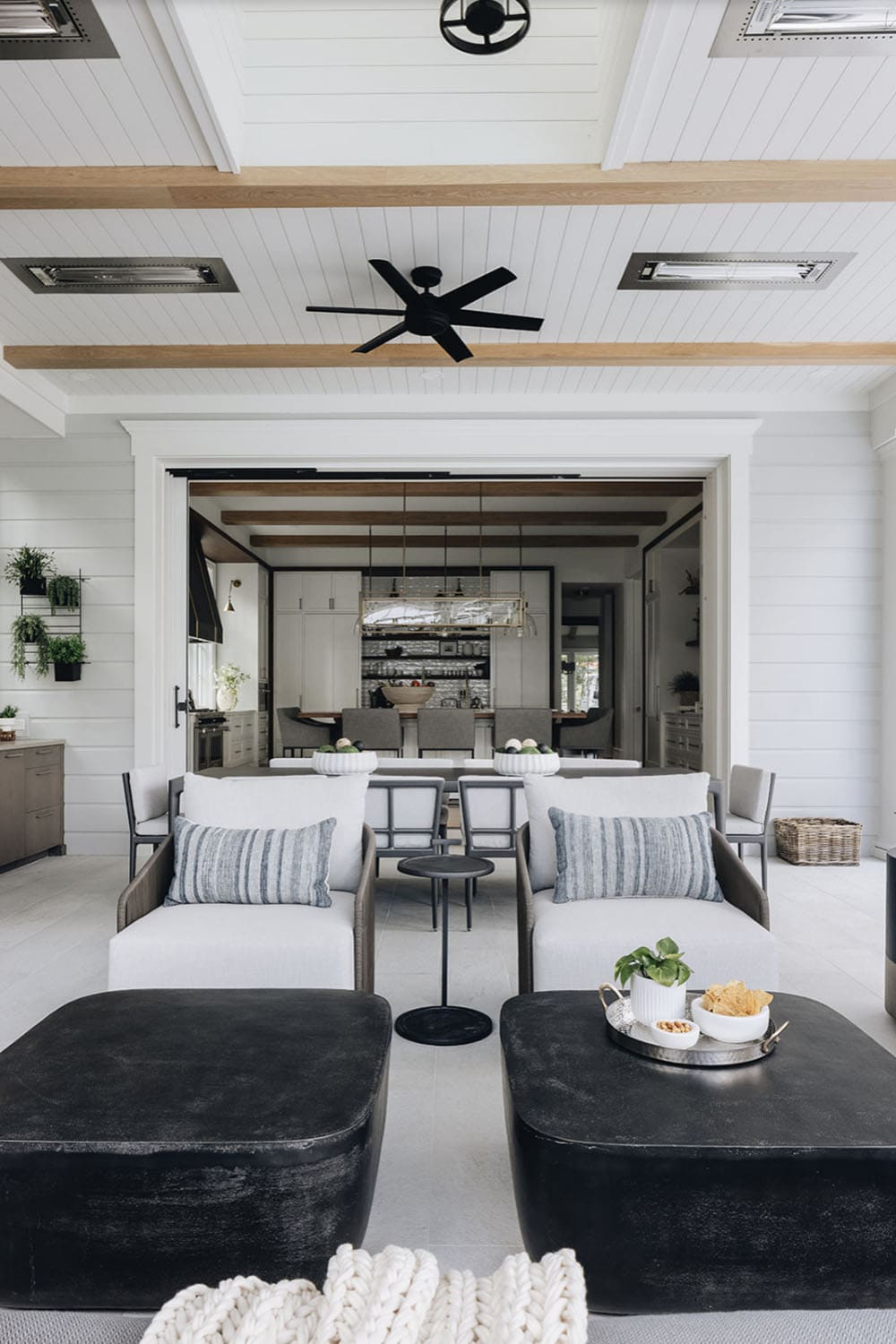 transitional screened porch with outdoor living room
