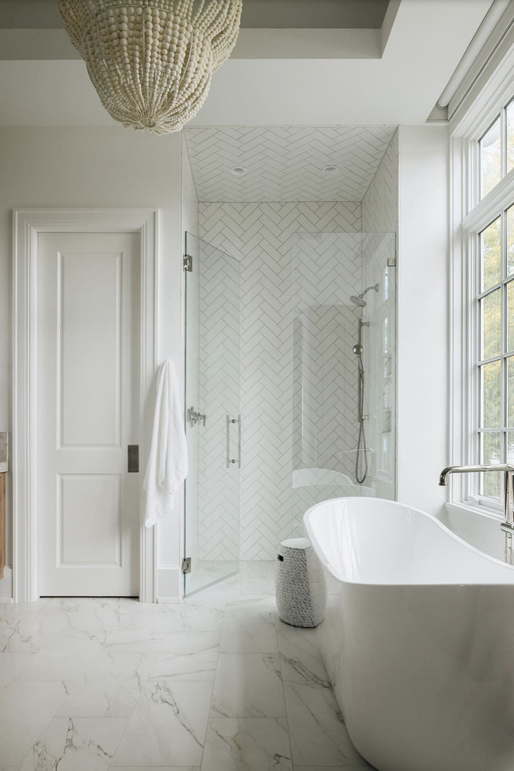 transitional bathroom with a freestanding tub