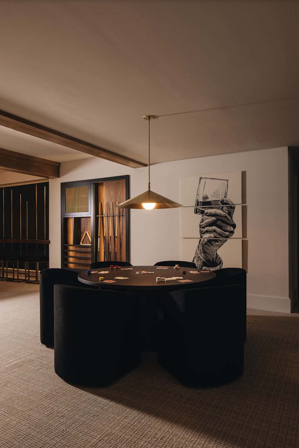 transitional lower level family room with a card table