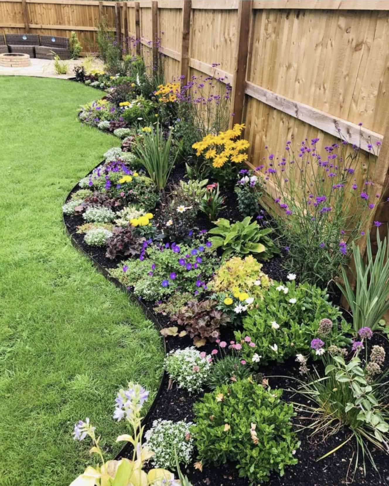 full corner garden with plants and flowers