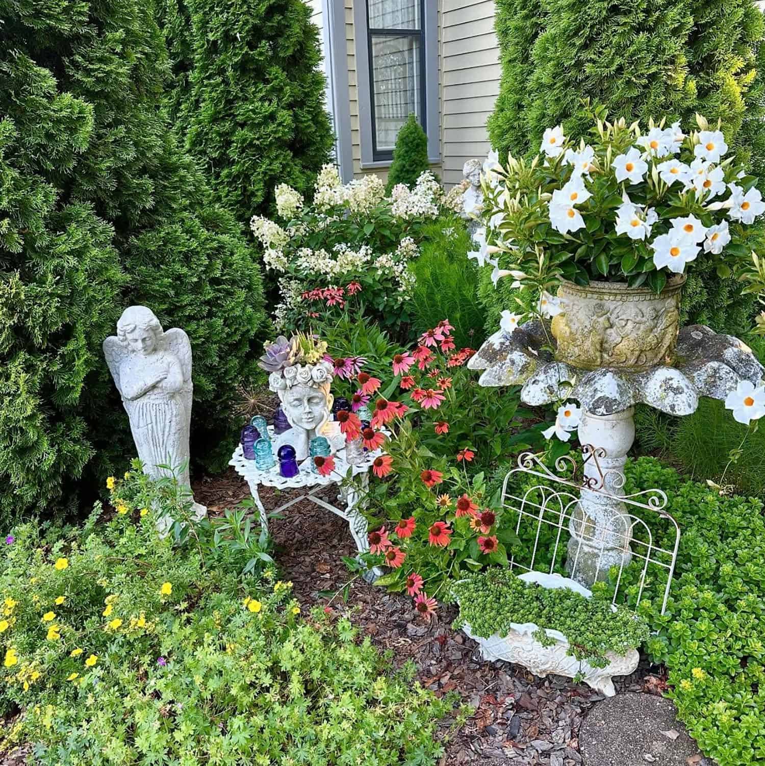 corner garden with an angel and head planter!!