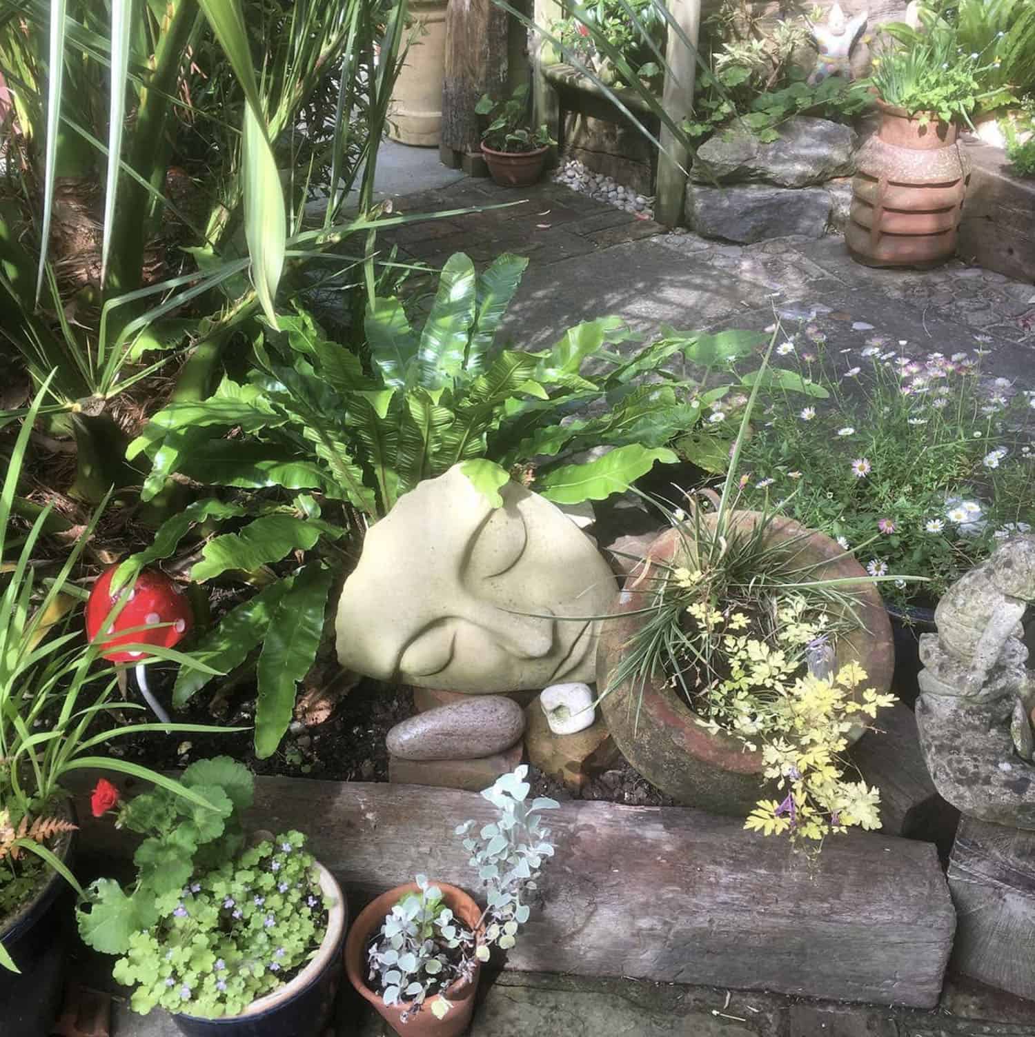 corner garden with a stone face