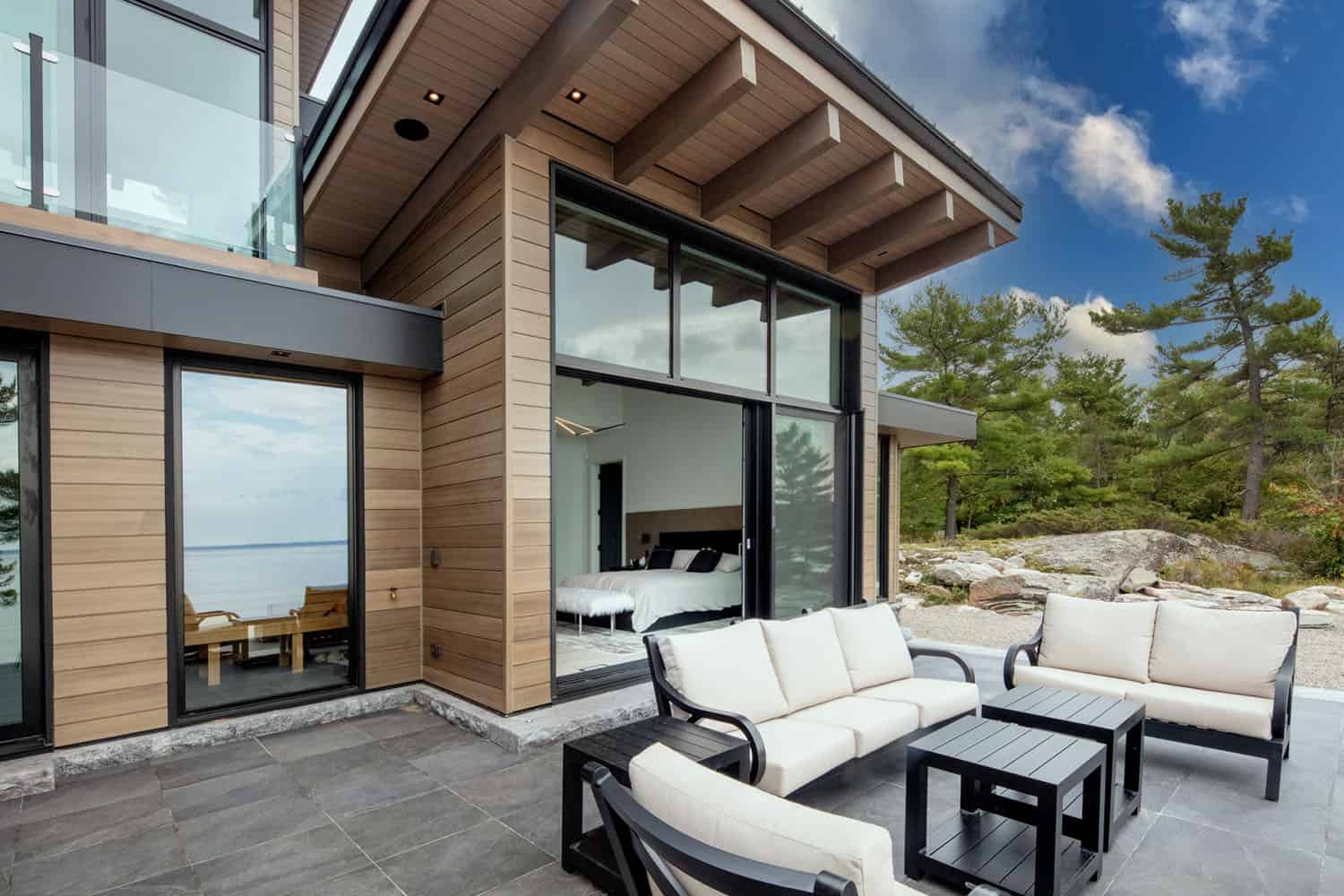 contemporary lakefront cottage patio with outdoor furniture