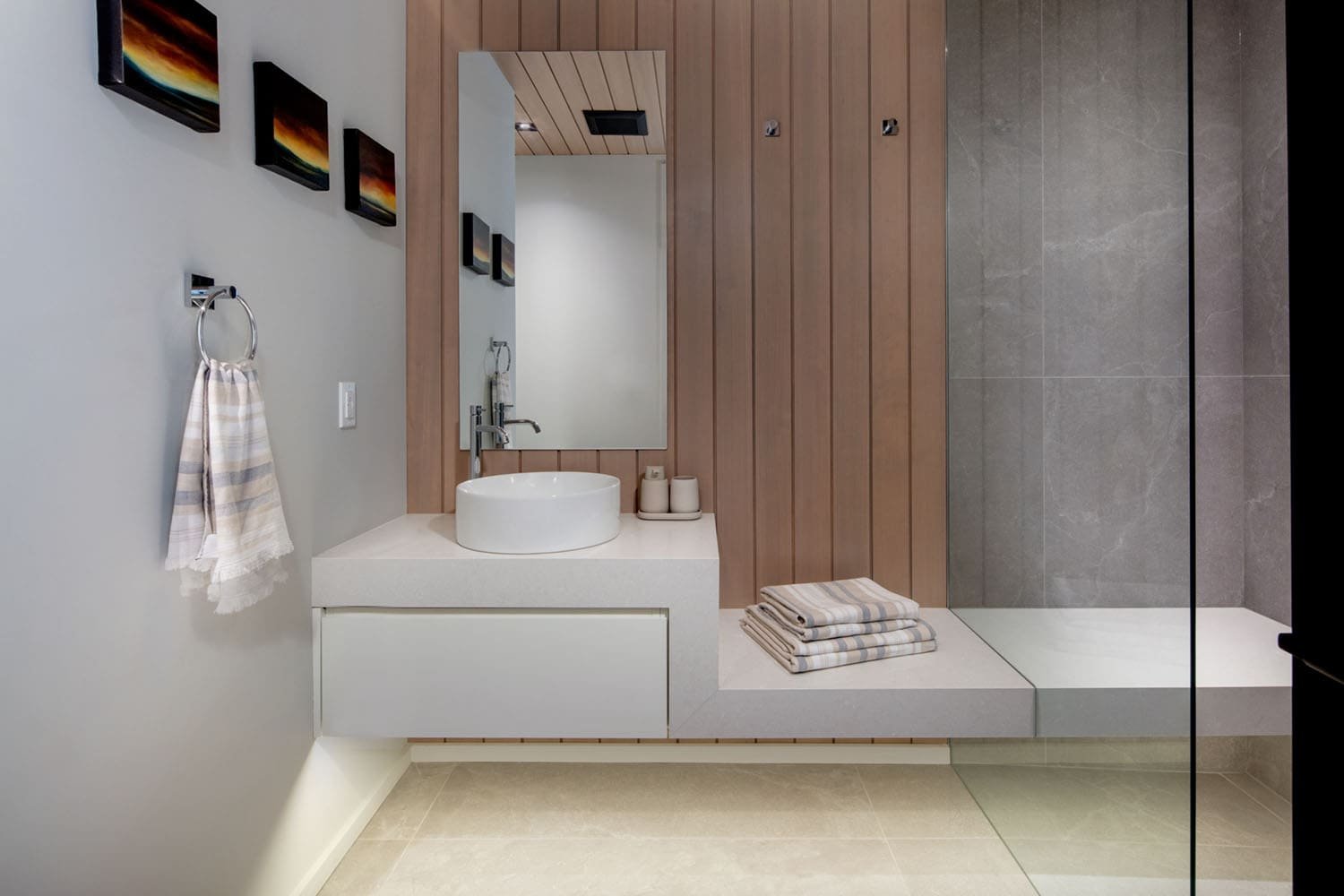 modern bathroom floating vanity with a shower and bench seat