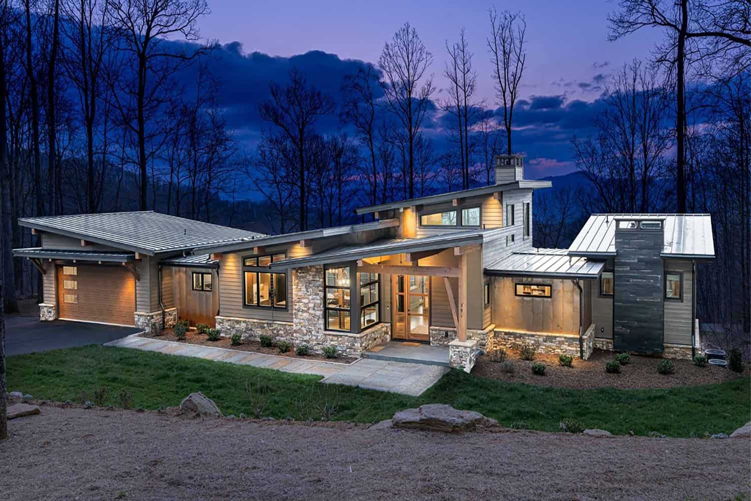 contemporary mountain home exterior at dusk
