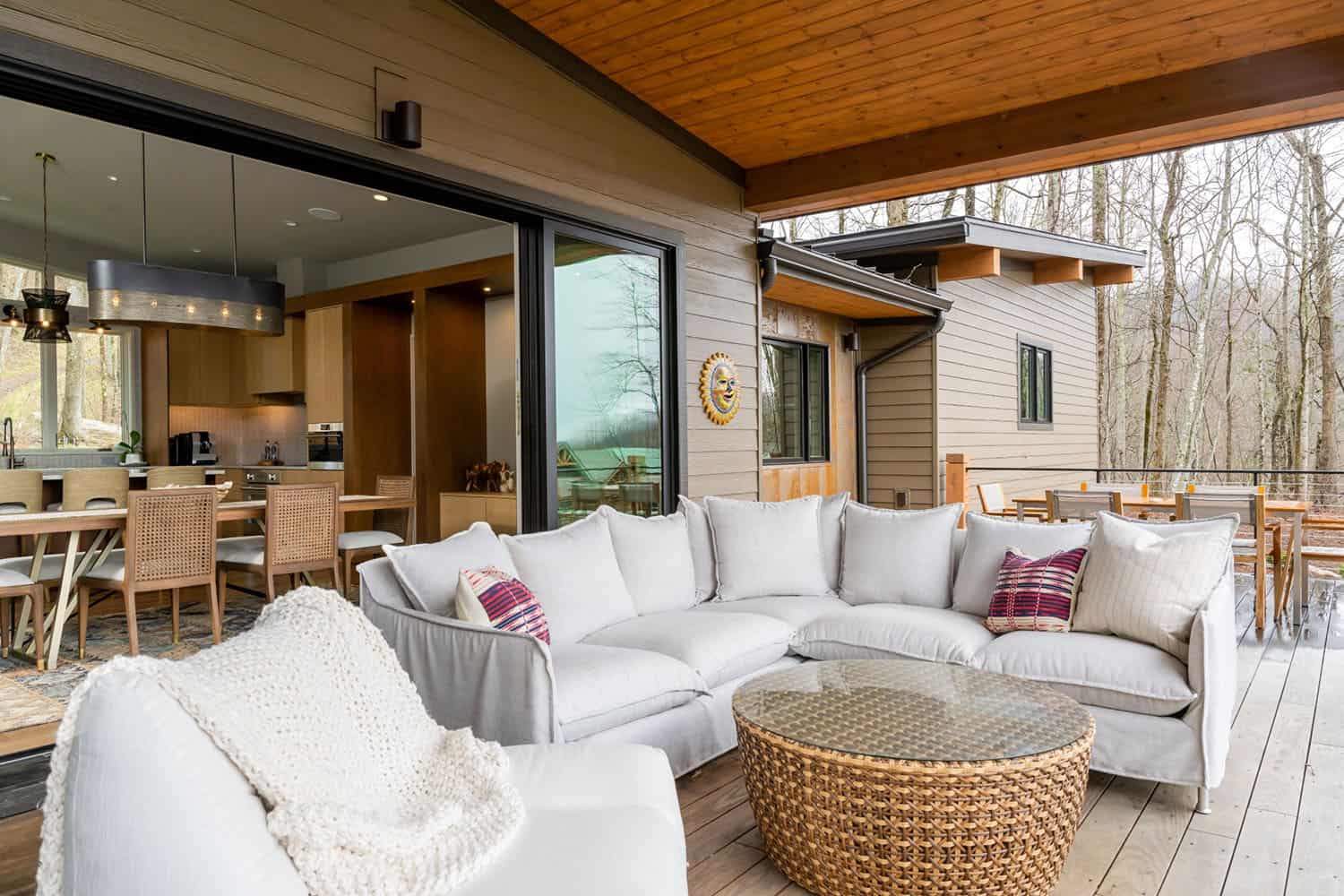 contemporary covered porch with outdoor furniture