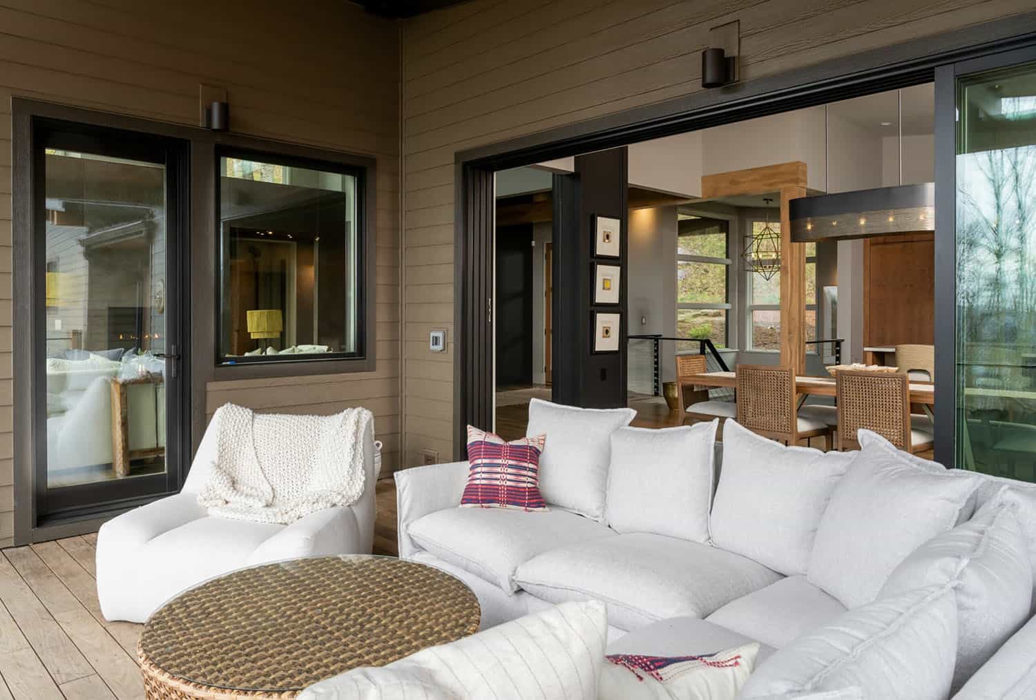contemporary covered porch with outdoor furniture