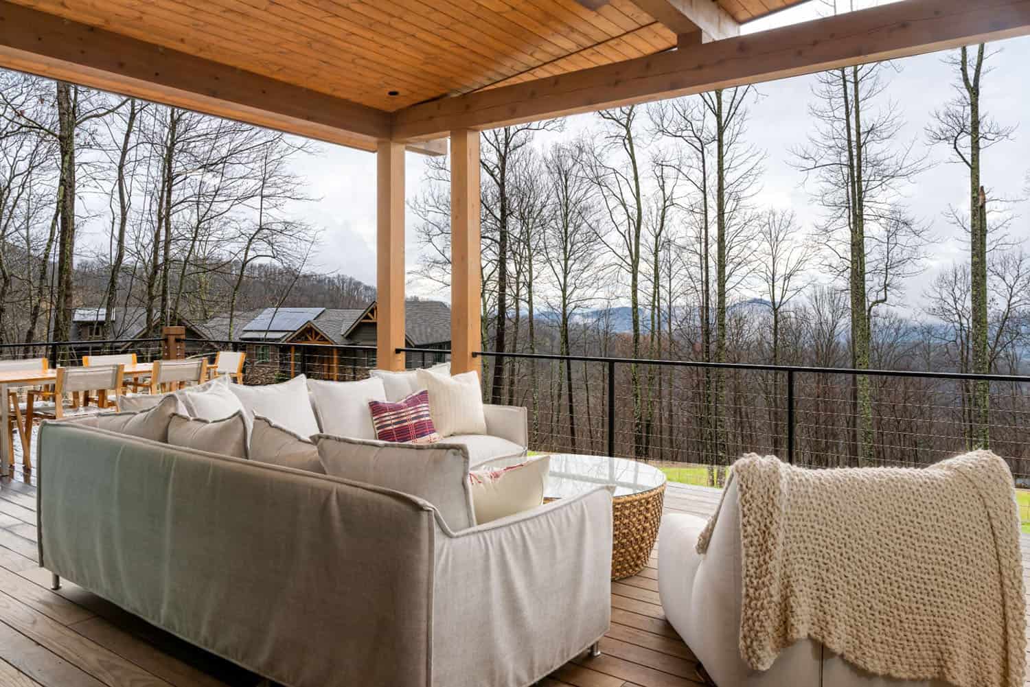 contemporary covered porch with outdoor furniture