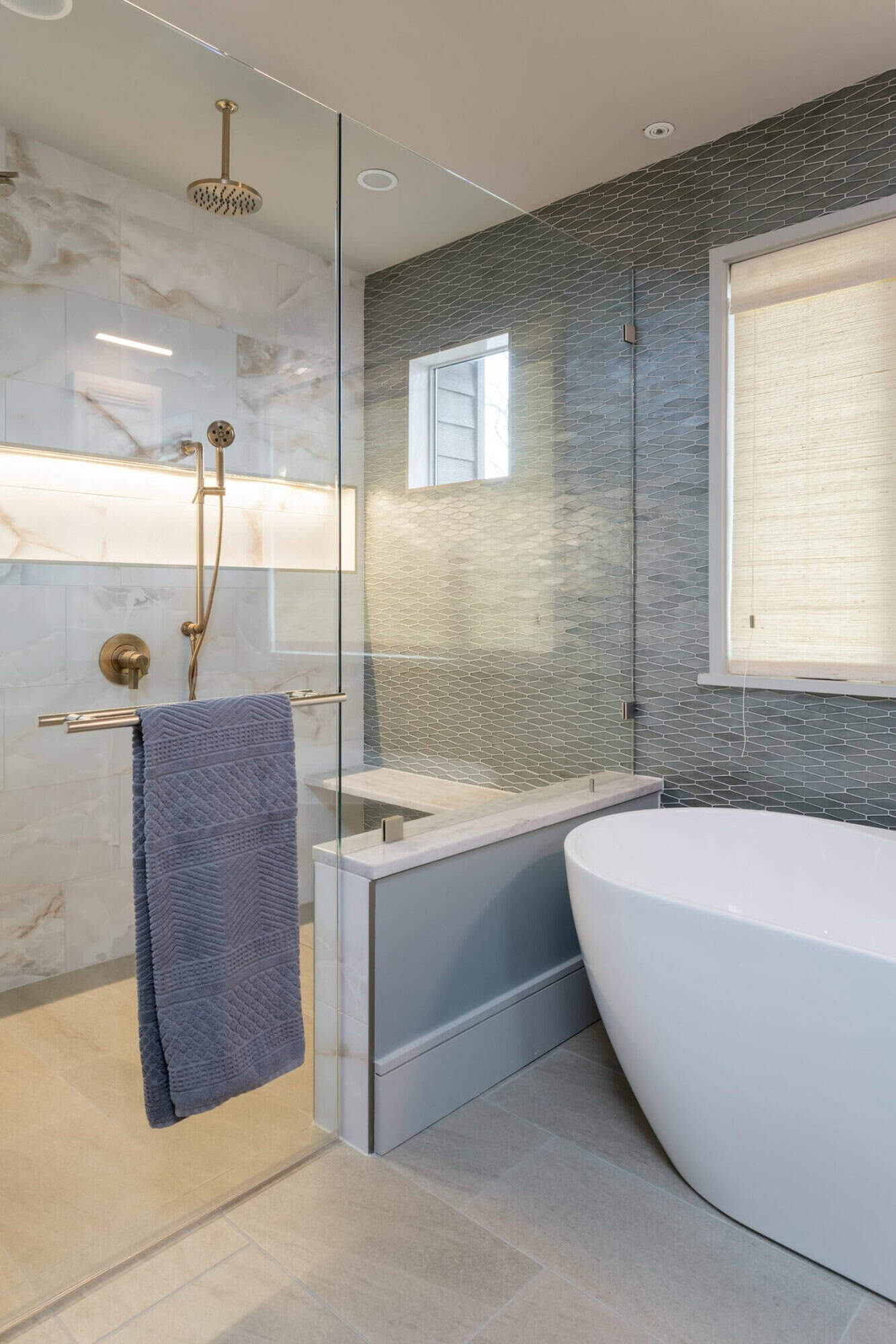 contemporary bathroom with a freestanding tub and shower