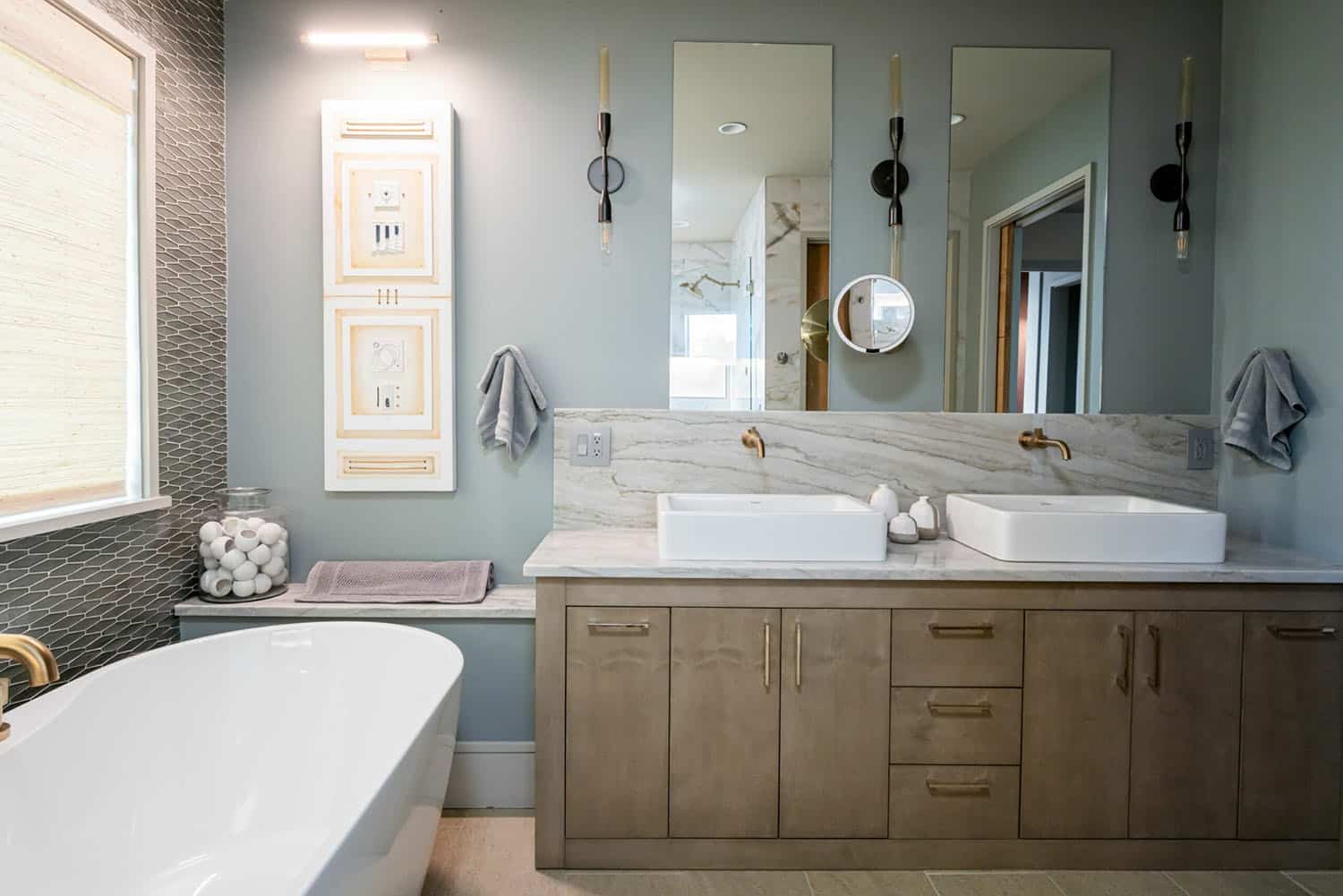contemporary bathroom with a freestanding tub and vanity
