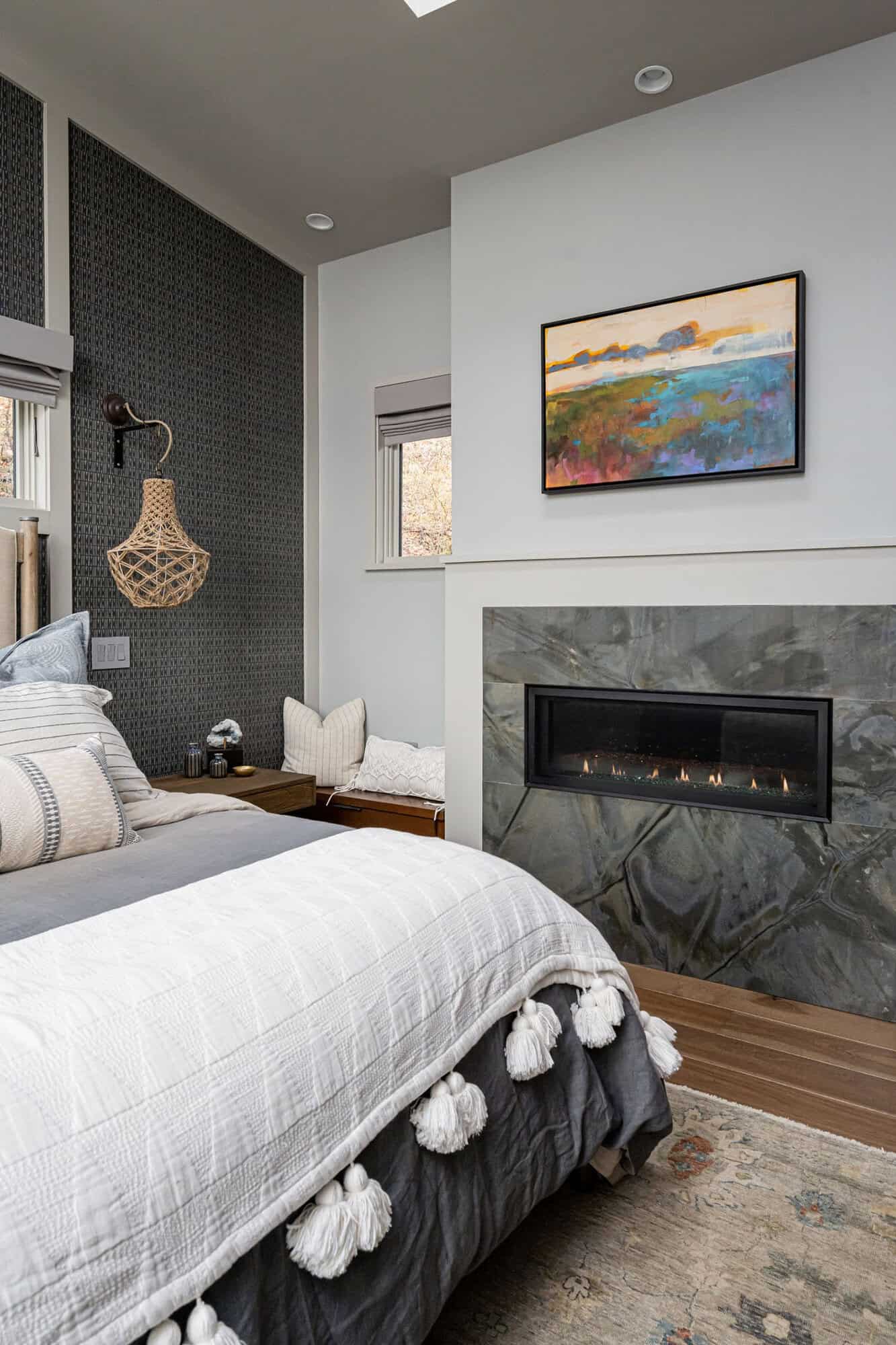 contemporary bedroom with a fireplace