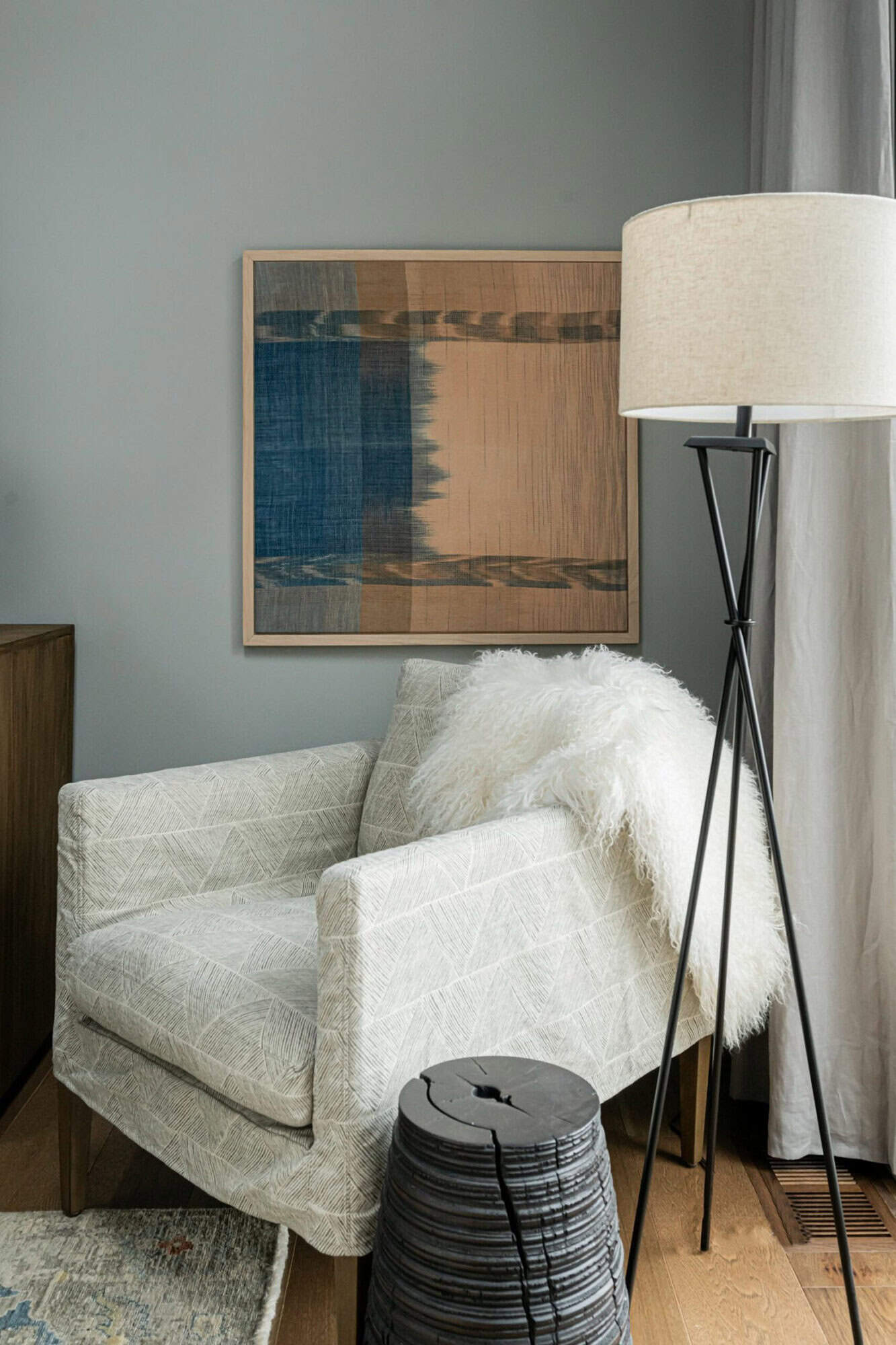 contemporary bedroom with a corner reading chair