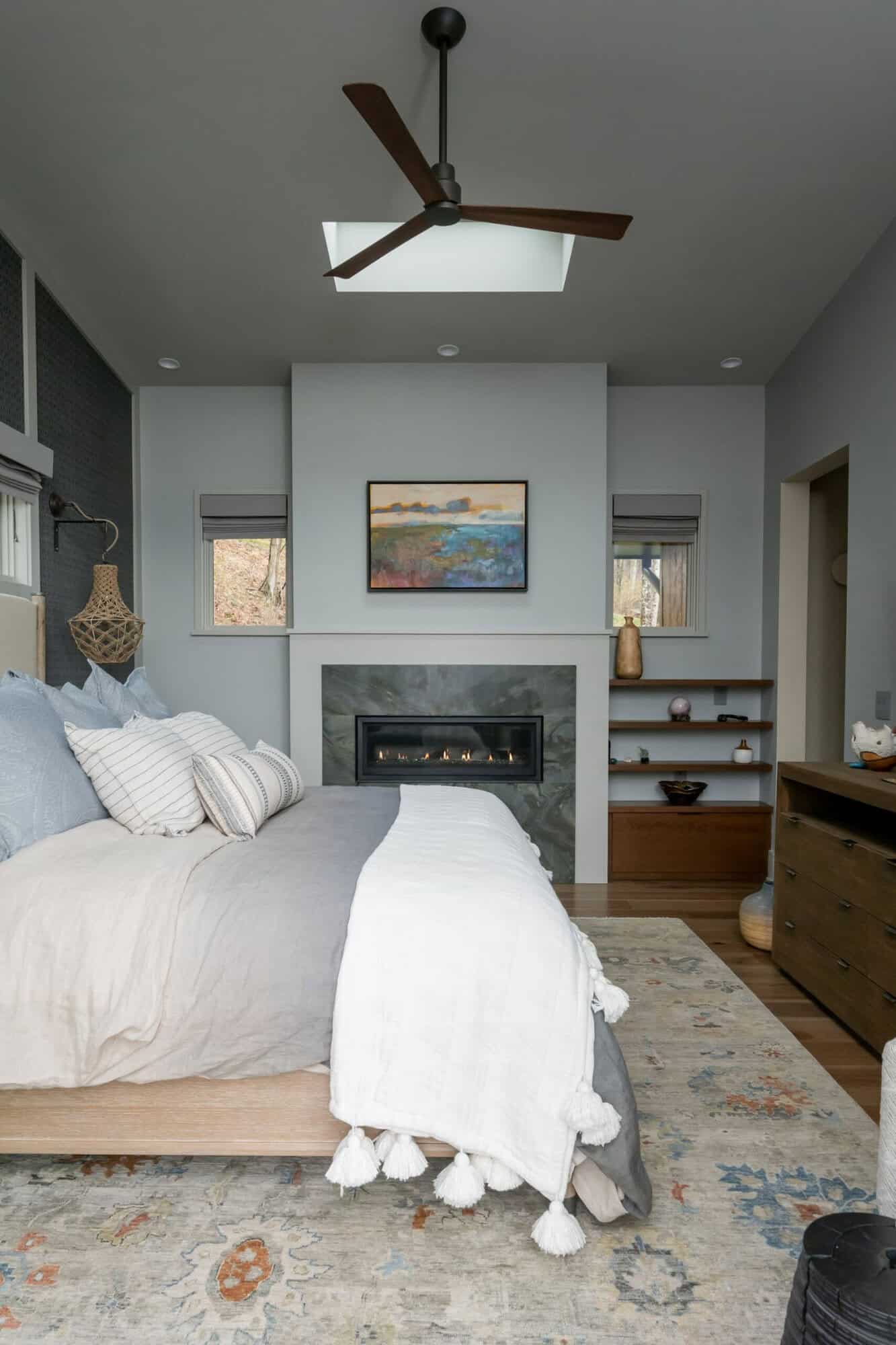 contemporary bedroom with a fireplace