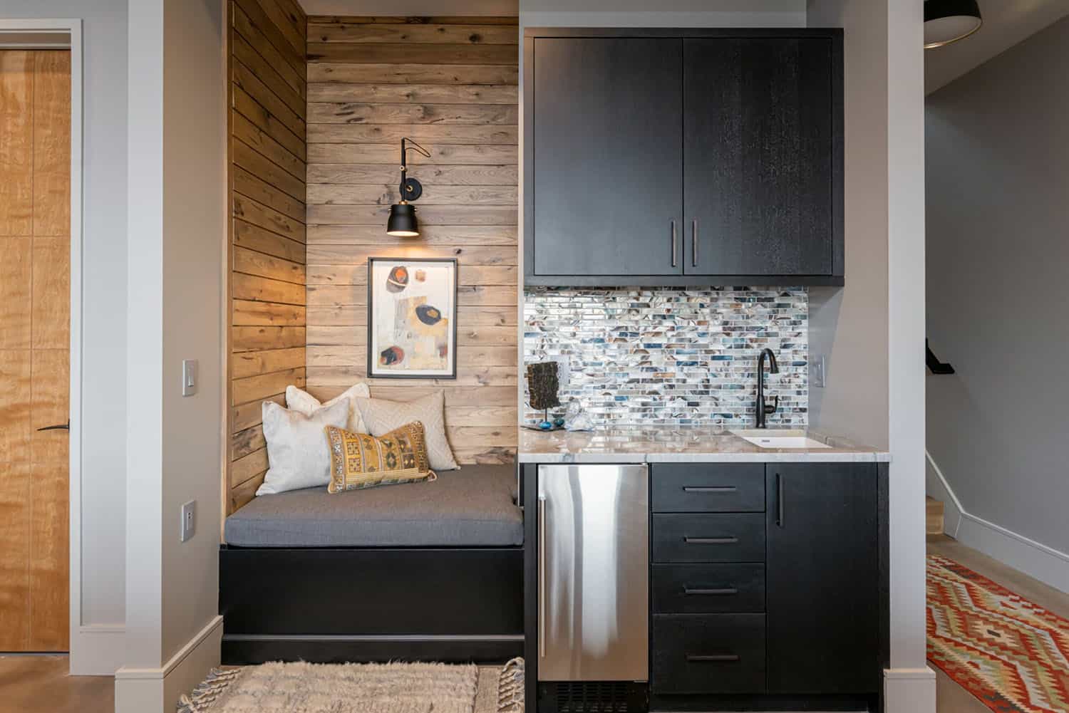 contemporary lower level home bar and reading nook