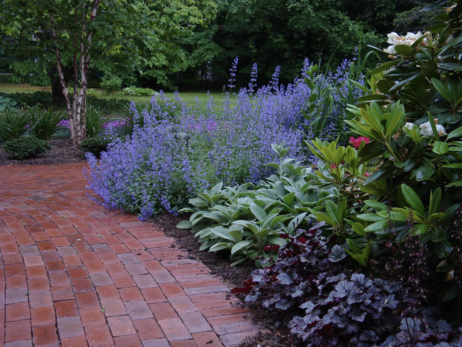 brick pathway with flowers