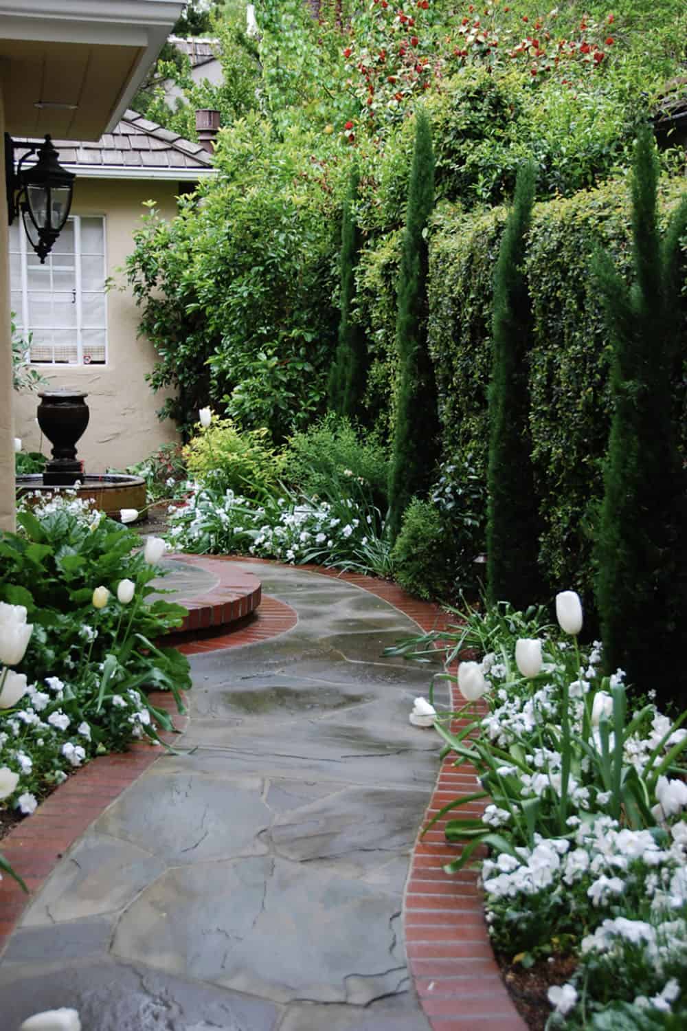 bluestone entry walk that terminates in a fountain courtyard