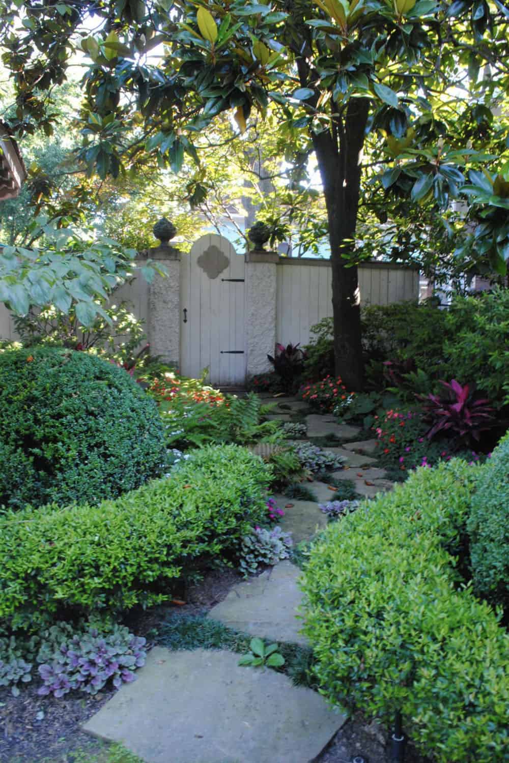 garden pathway with a fence