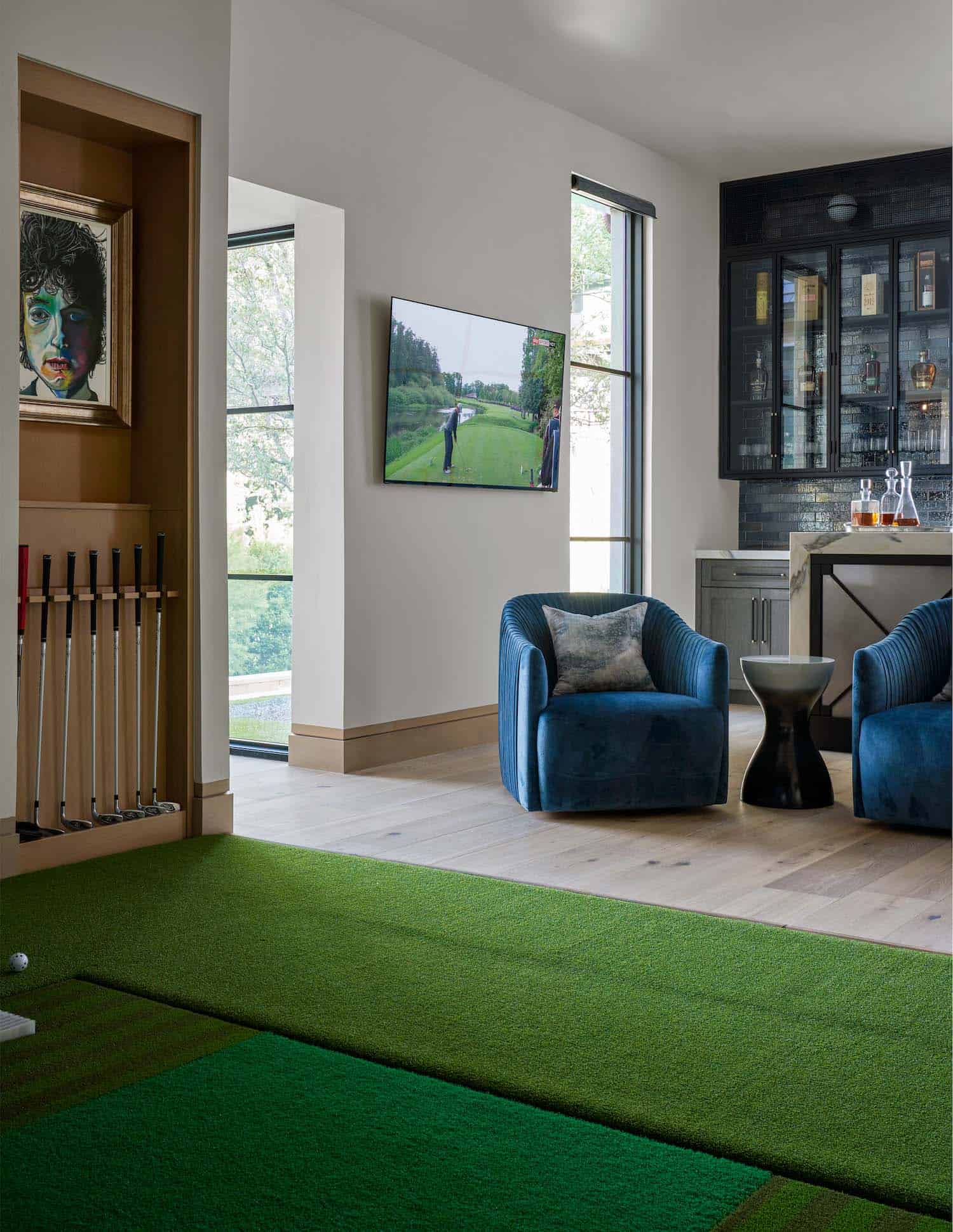 contemporary home bar with a golf simulator room