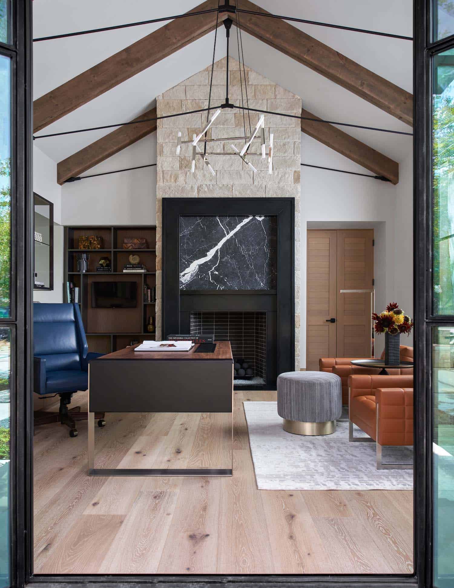 contemporary home office with a fireplace